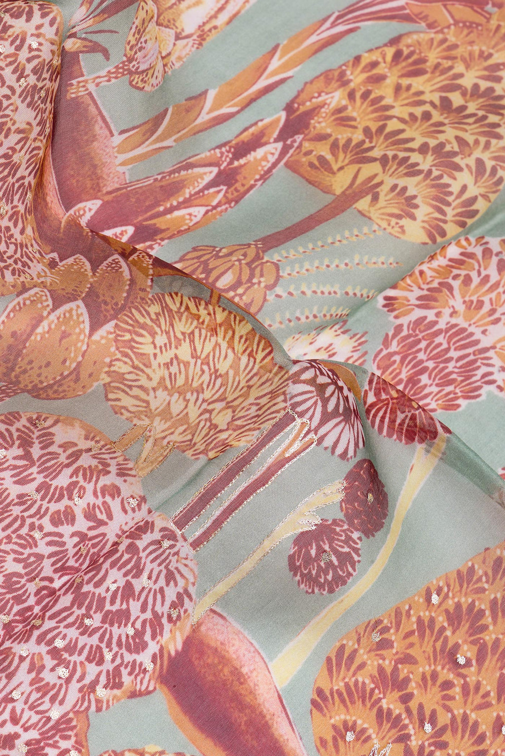Close up of Grey Organza Silk Saree with Embroidery on the body and Embroidery Border.  displaying folds