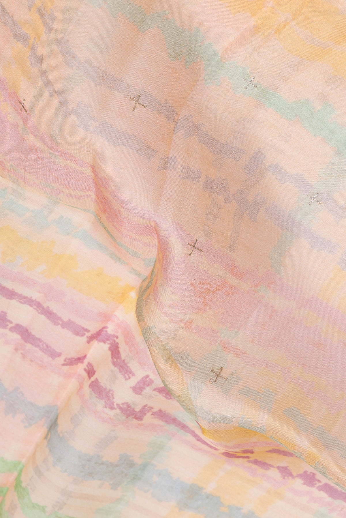Close up of Orange Dual Tone Organza Silk Saree with Embroidery on the body and Embroidery Border.  displaying folds