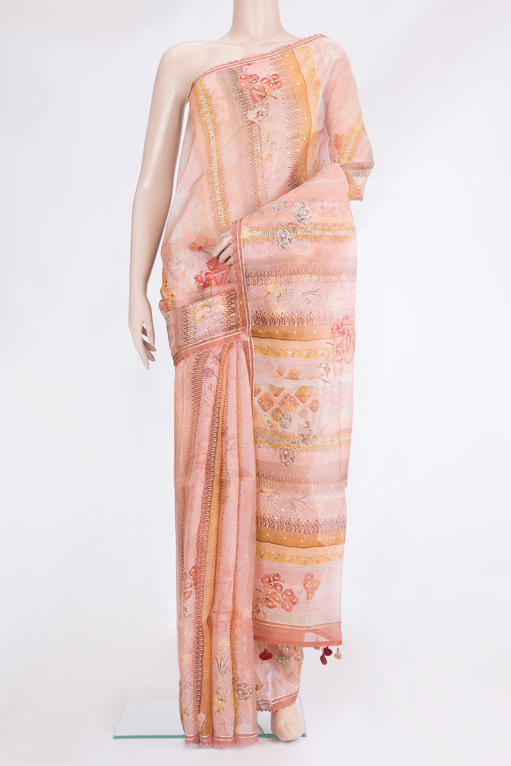 Peach Organza Silk Saree with Embroidery on the body and Embroidery Border.  displayed on a mannequin