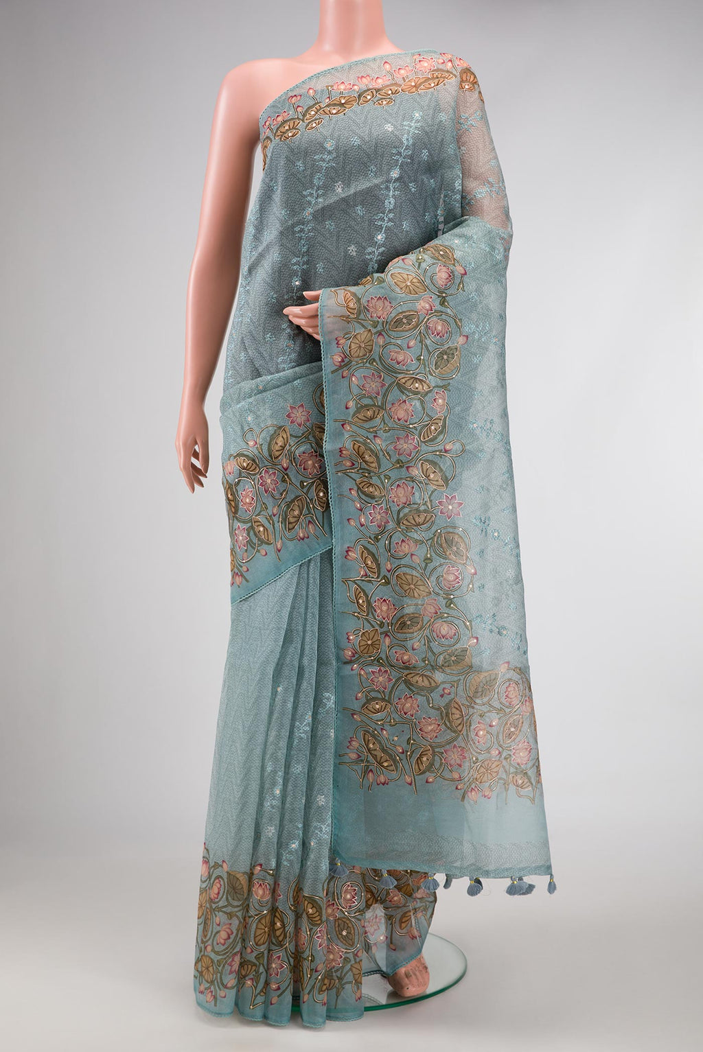 Blue Dual Tone Organza Silk Saree with Printed design on the body and Embroidery Border.  displayed on a mannequin