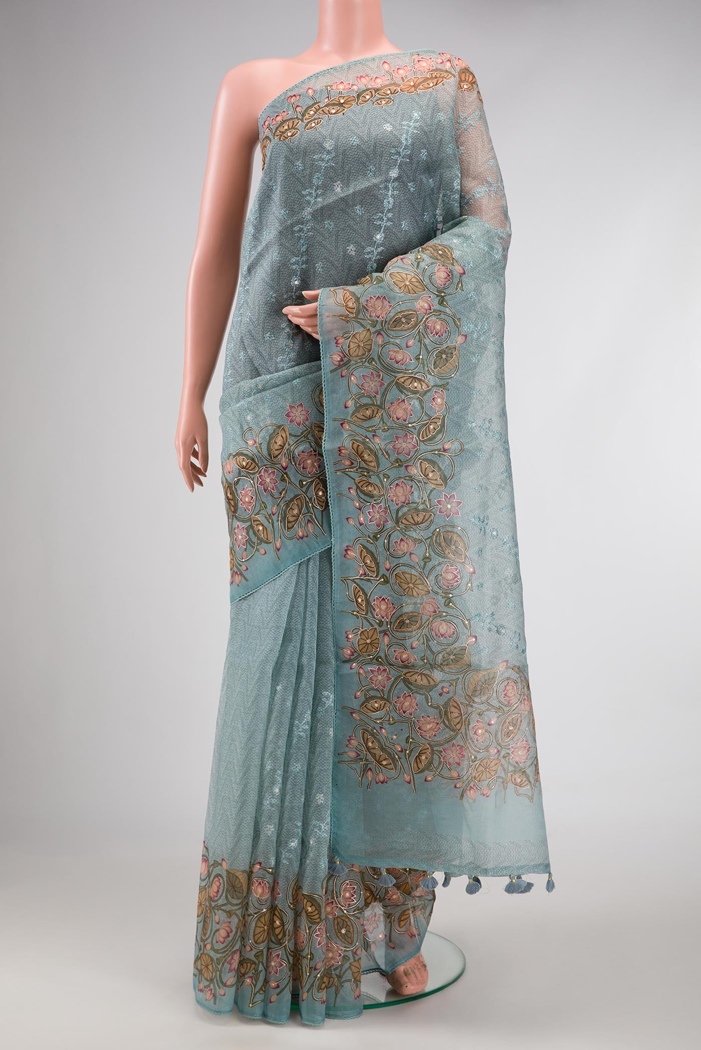 Blue Dual Tone Organza Silk Saree with Printed design on the body and Embroidery Border.  displayed on a mannequin