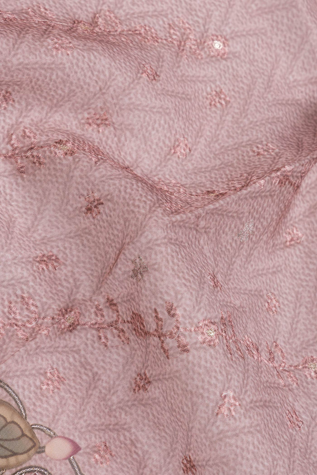 Close up of Pink Dual Tone Organza Silk Saree with Embroidery on the body and Embroidery Border.  displaying folds