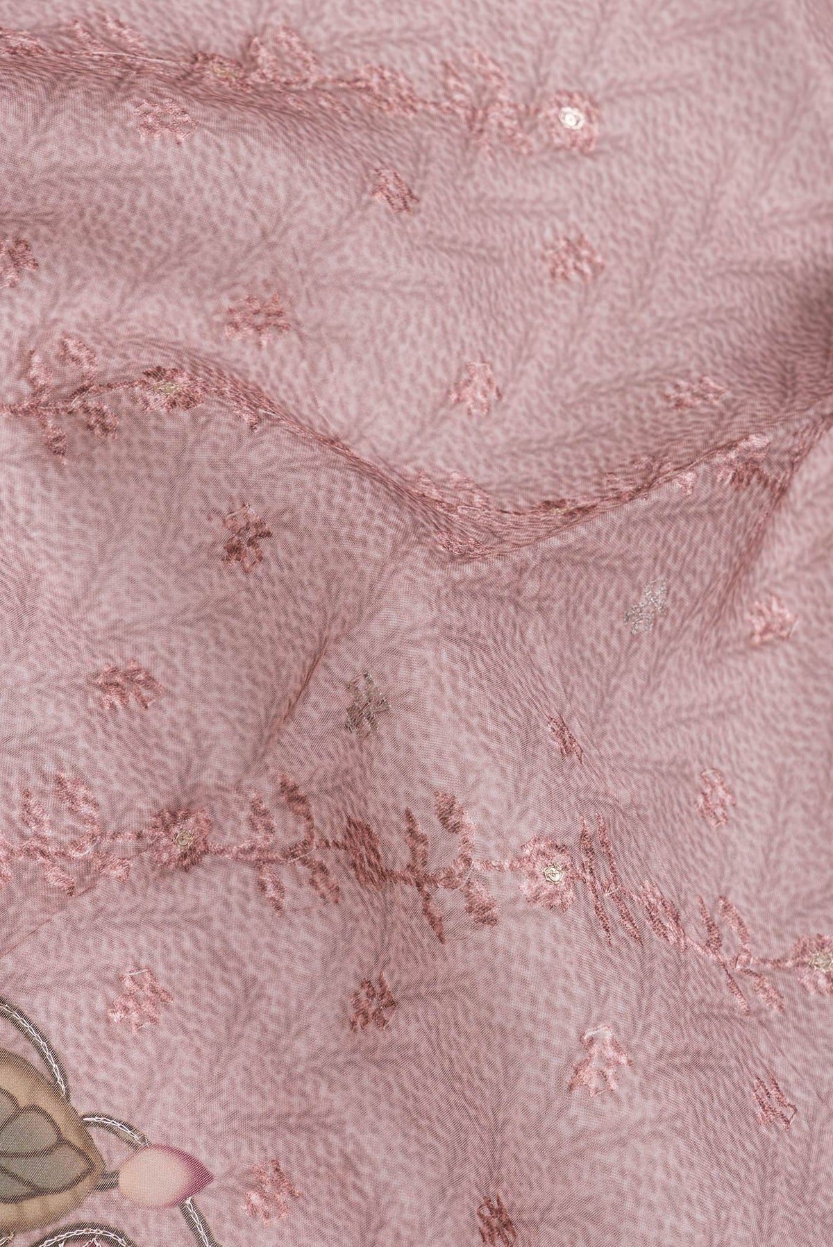 Close up of Pink Dual Tone Organza Silk Saree with Embroidery on the body and Embroidery Border.  displaying folds