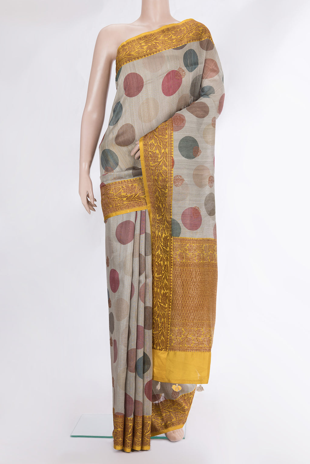 Pure Silk Dark Beige Tussar Saree with Zari Butta on the body and Zari Border.  displayed on a mannequin