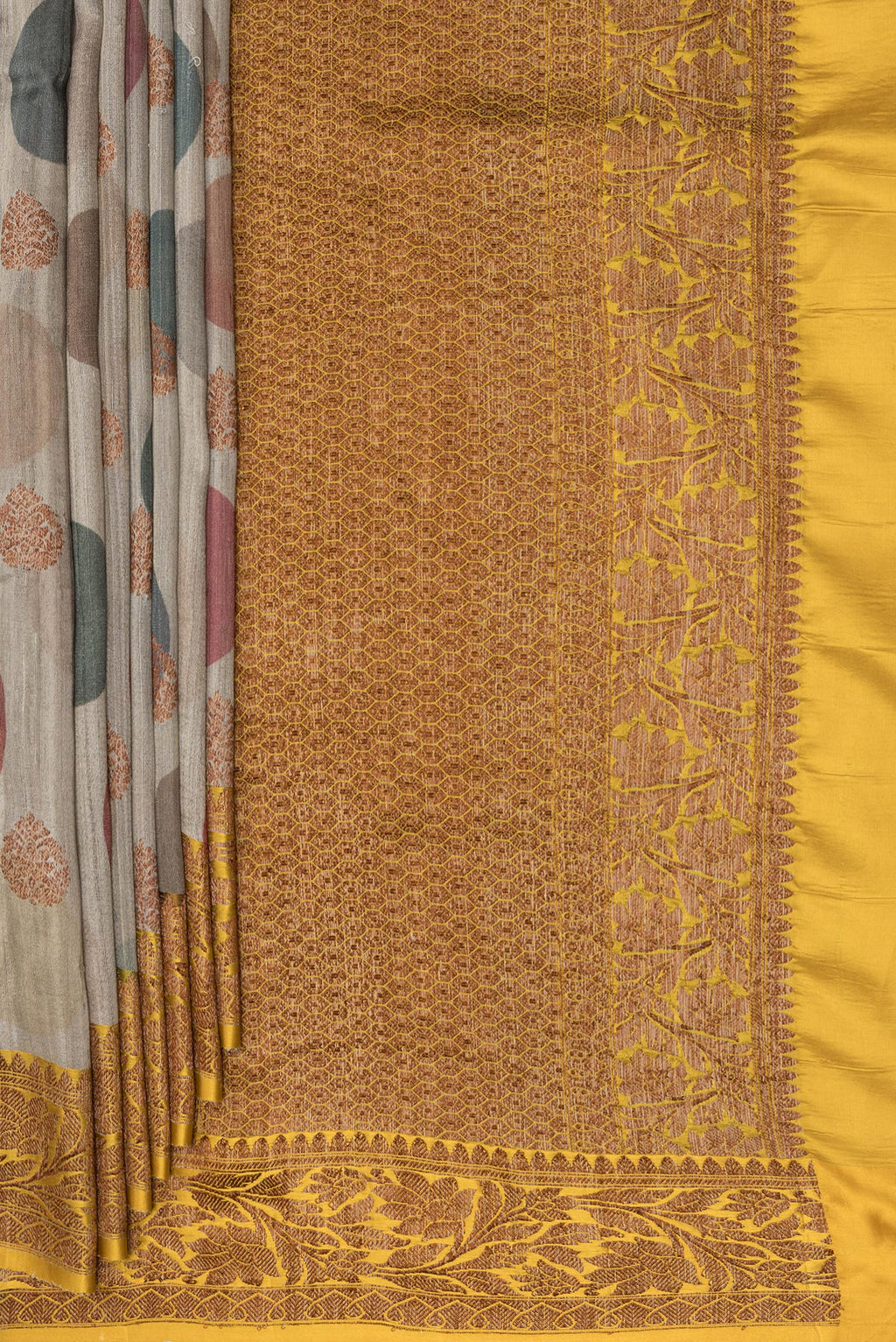Pleats and pallu of Pure Silk Dark Beige Tussar Saree with Zari Butta on the body and Zari Border. 