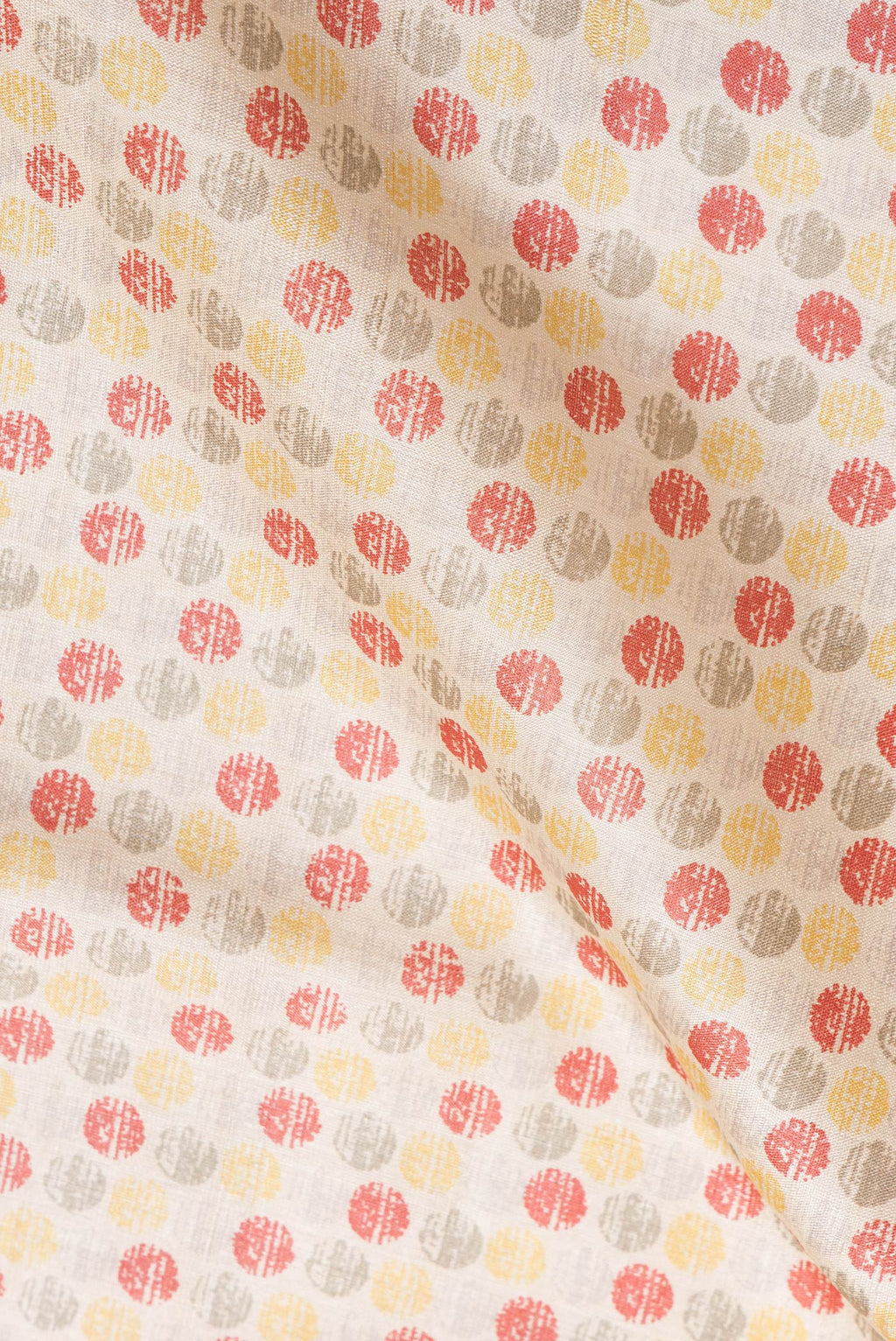 Close up of Beige Dual Tone Tussar Silk Saree with Printed design on the body and Thread Border.  displaying folds