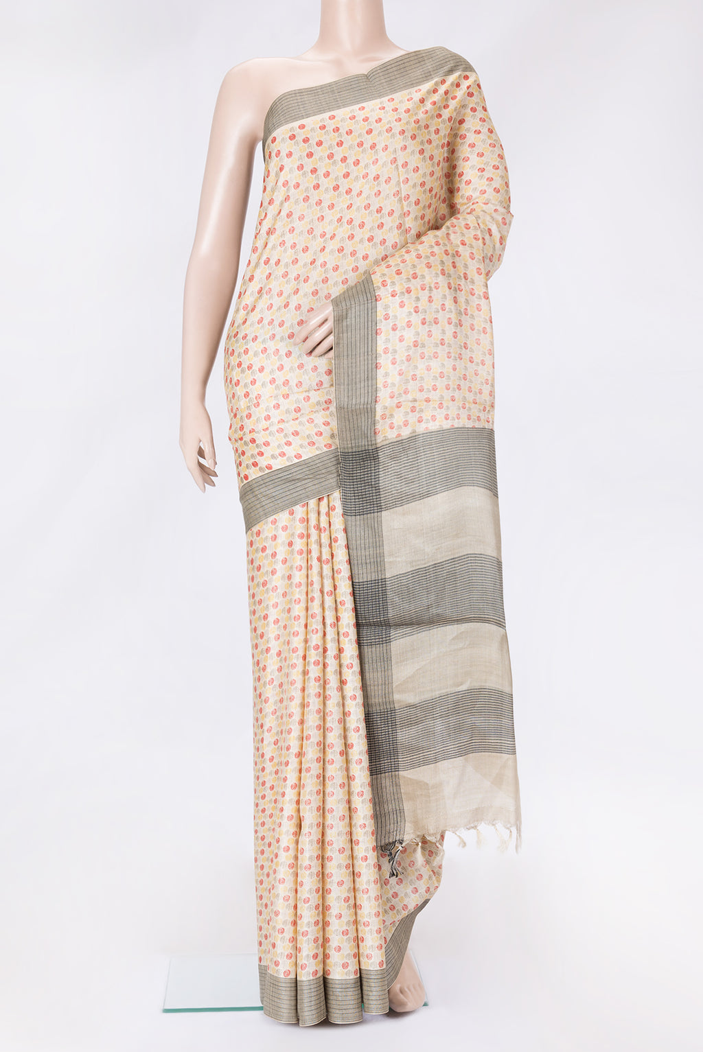 Beige Dual Tone Tussar Silk Saree with Printed design on the body and Thread Border.  displayed on a mannequin