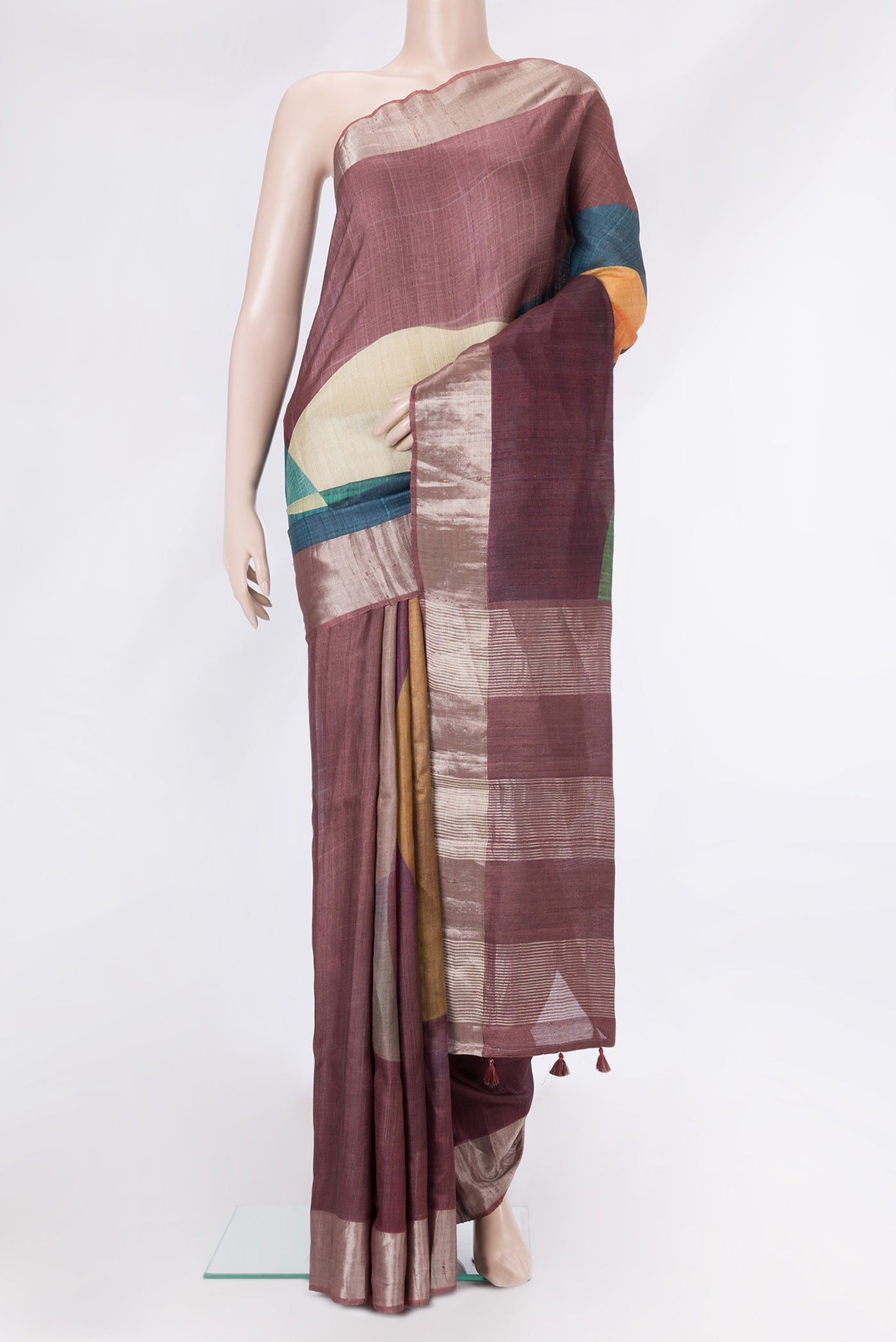 Maroon Dual Tone Tussar Silk Saree with Printed design on the body and Zari Border.  displayed on a mannequin