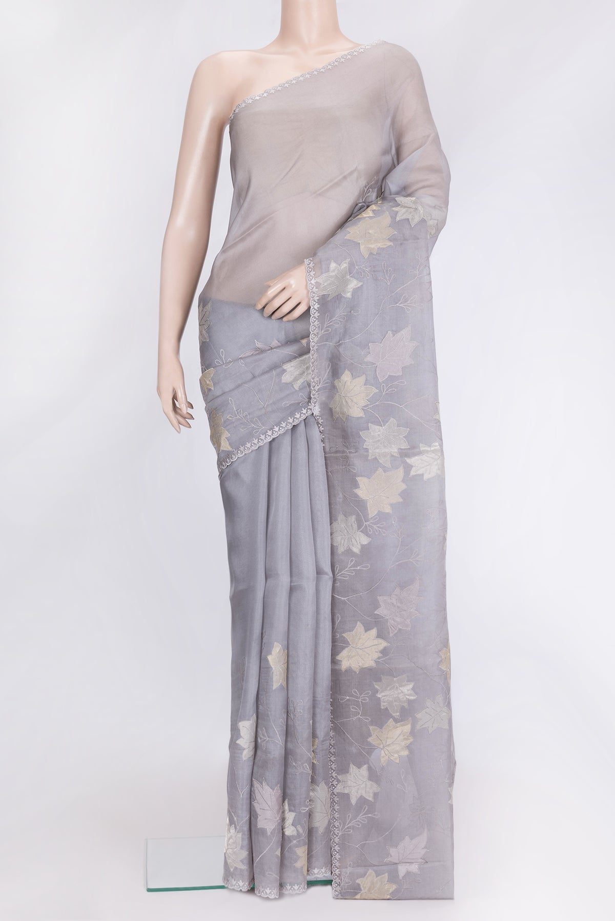 Grey Dual Tone Organza Silk Saree with Embroidery on the body and Embroidery Border.  displayed on a mannequin