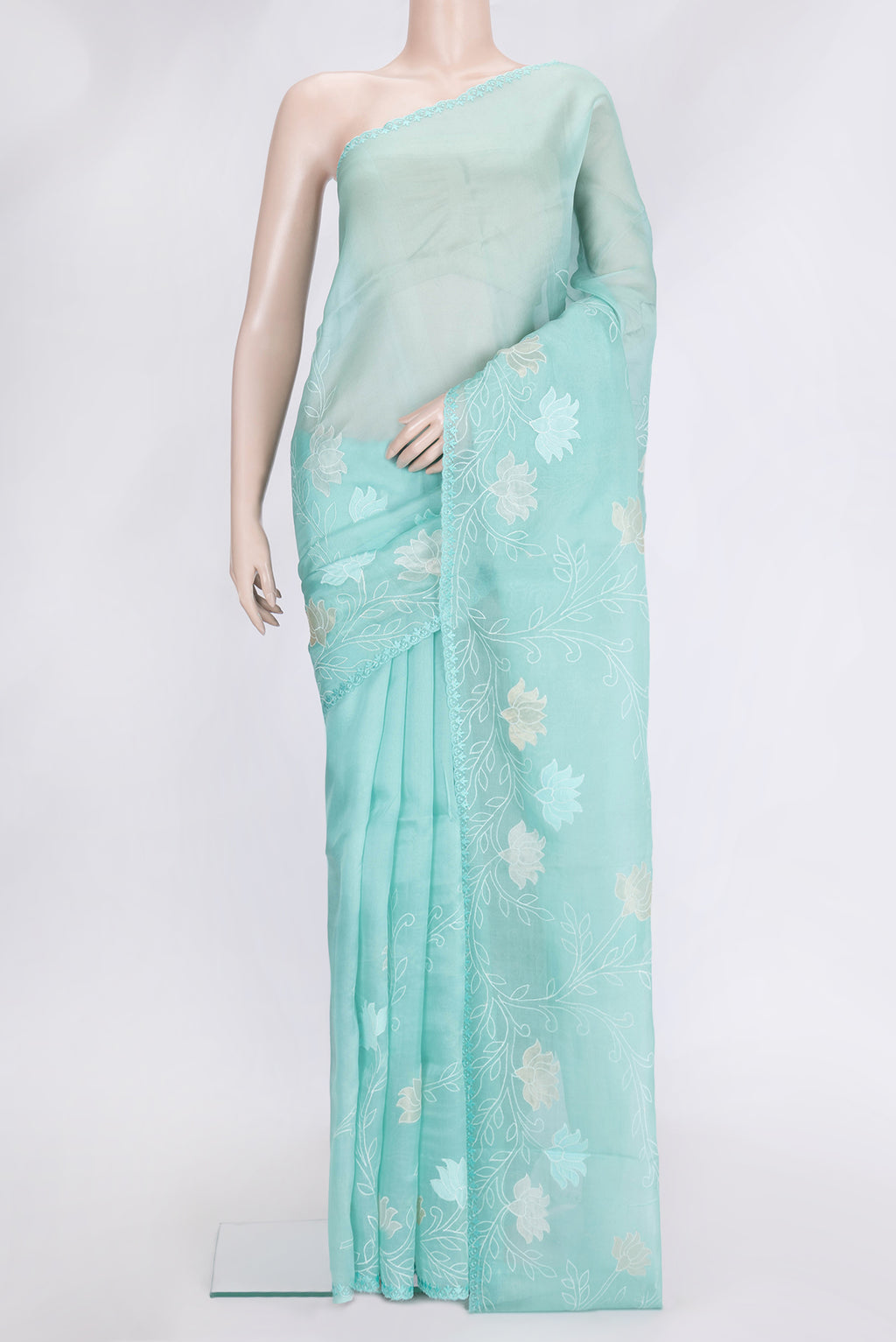 Sea Green Dual Tone Organza Silk Saree with Embroidery on the body and Embroidery Border.  displayed on a mannequin