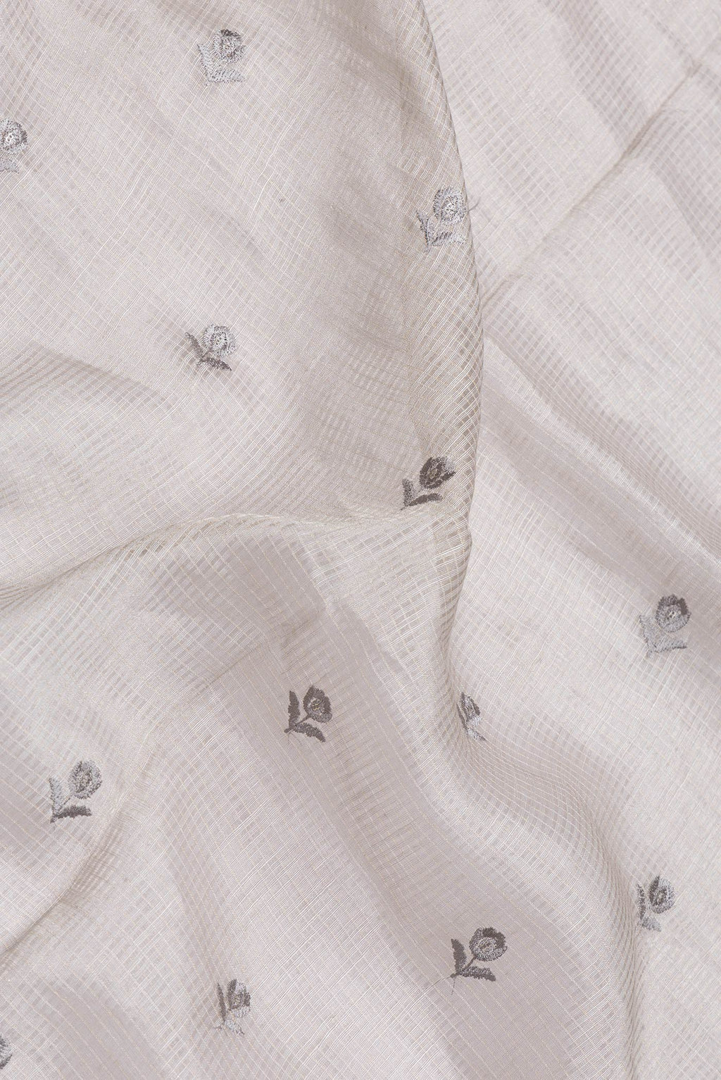 Close up of Grey Dual Tone Organza Silk Saree with Embroidery on the body and Embroidery Border.  displaying folds
