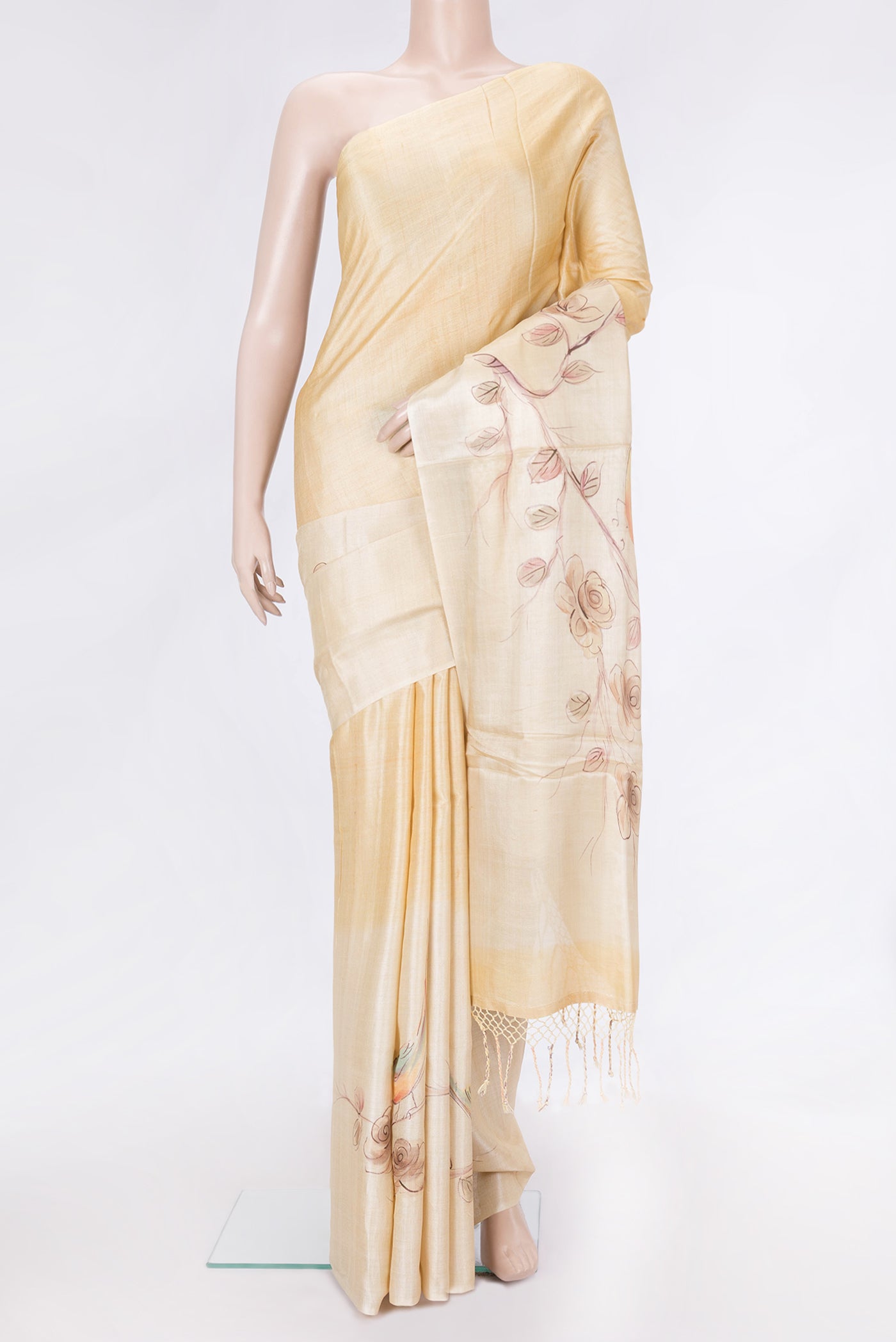 Beige Dual Tone Tussar Silk Saree with Plain Body and Printed Border.  displayed on a mannequin