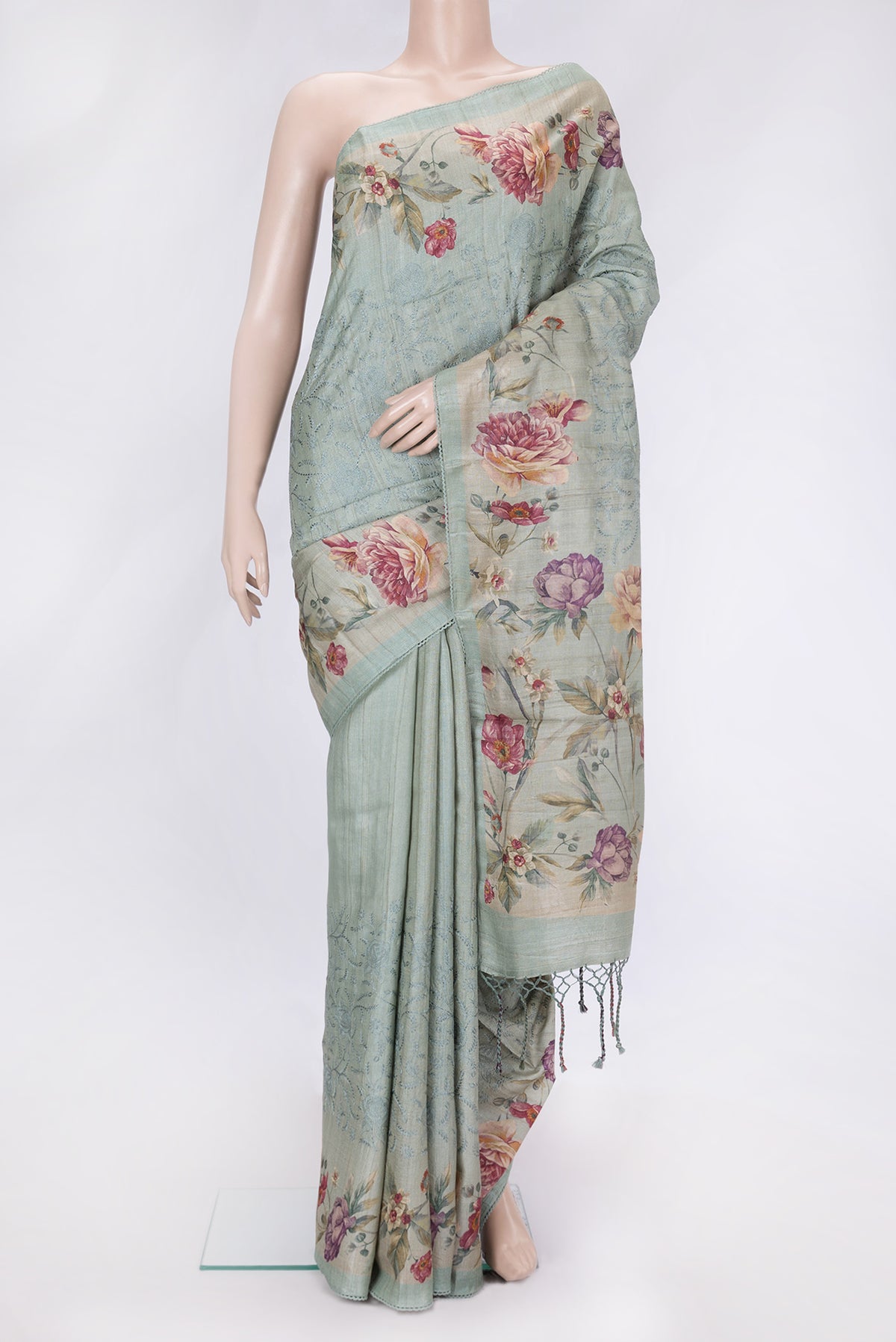 Sea Green Dual Tone Tussar Silk Saree with Embroidery on the body and Printed Border.  displayed on a mannequin