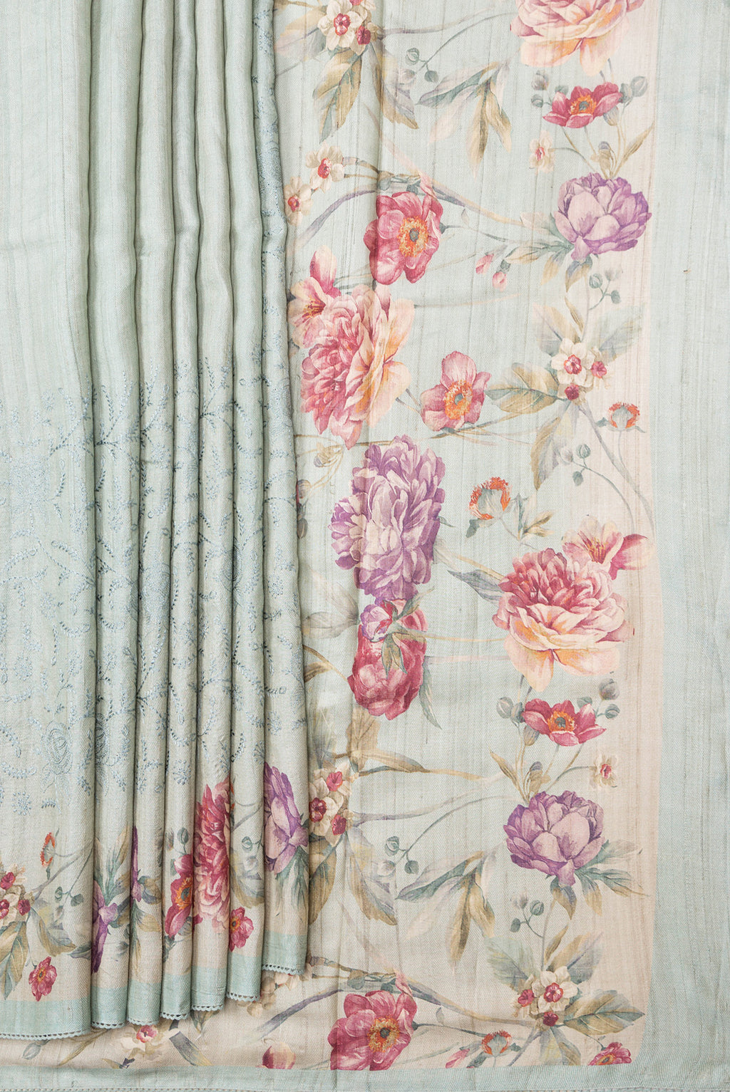 Pleats and pallu of Sea Green Dual Tone Tussar Silk Saree with Embroidery on the body and Printed Border. 