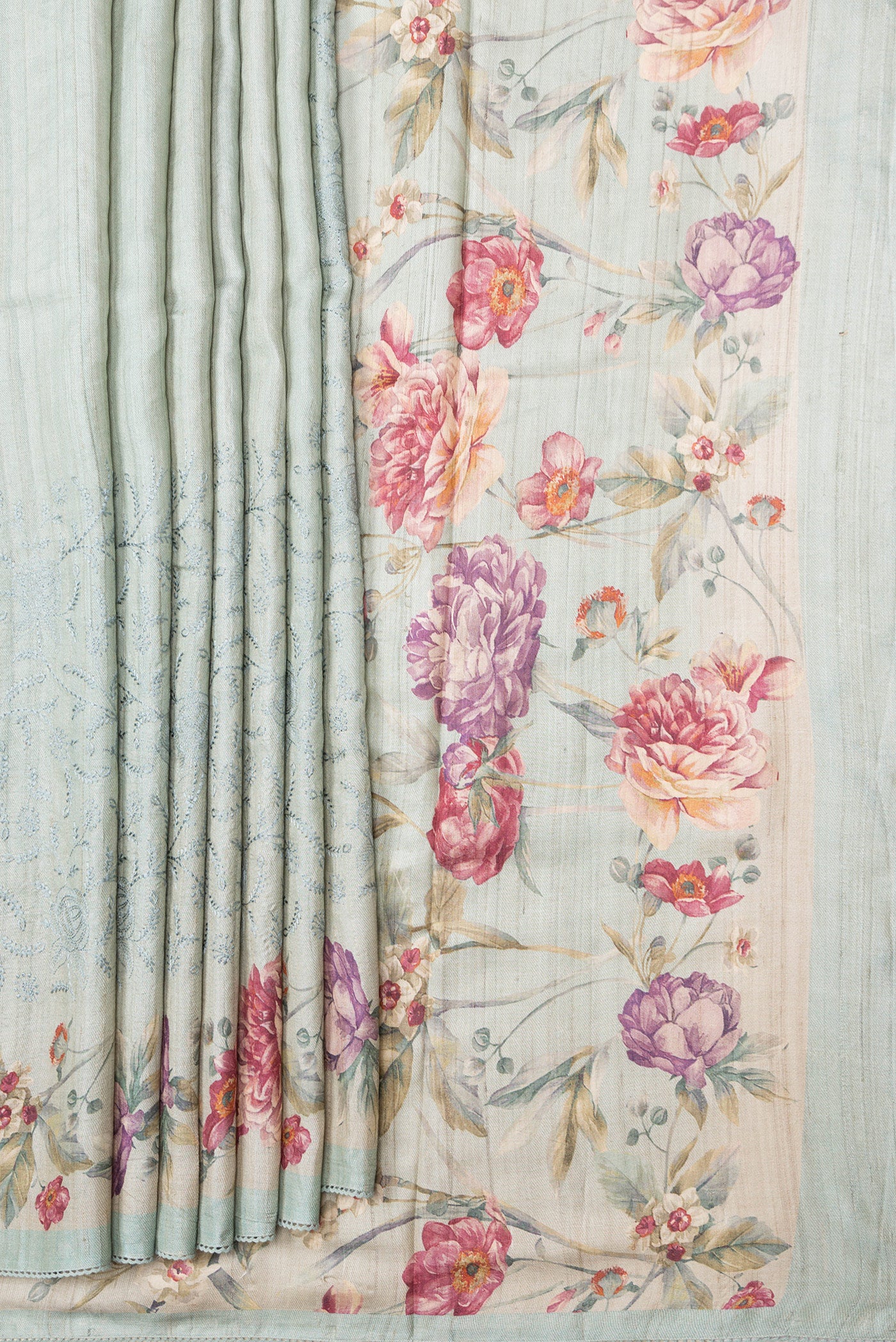 Pleats and pallu of Sea Green Dual Tone Tussar Silk Saree with Embroidery on the body and Printed Border. 