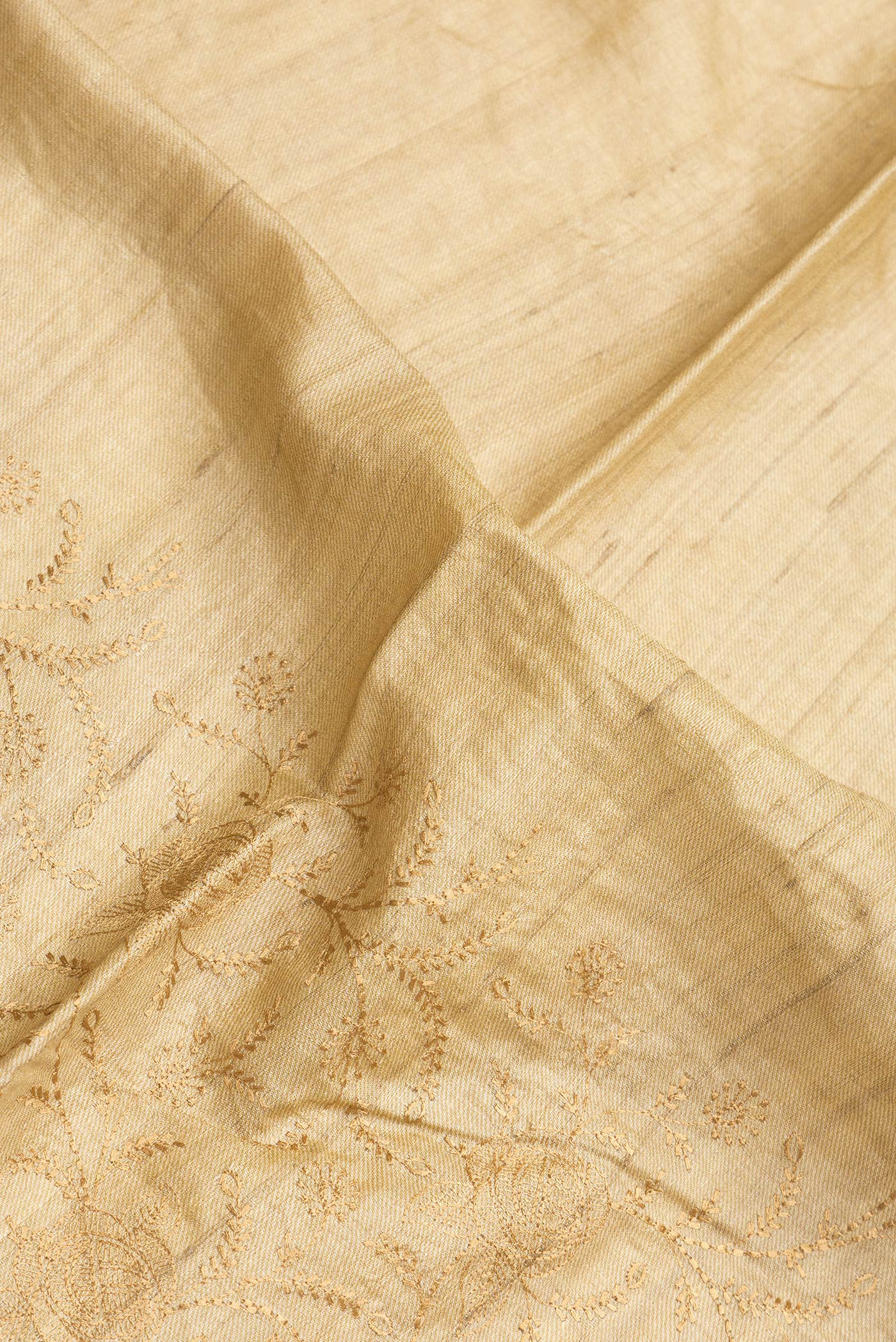 Close up of Sandal Dual Tone Tussar Silk Saree with Embroidery on the body and Printed Border.  displaying folds
