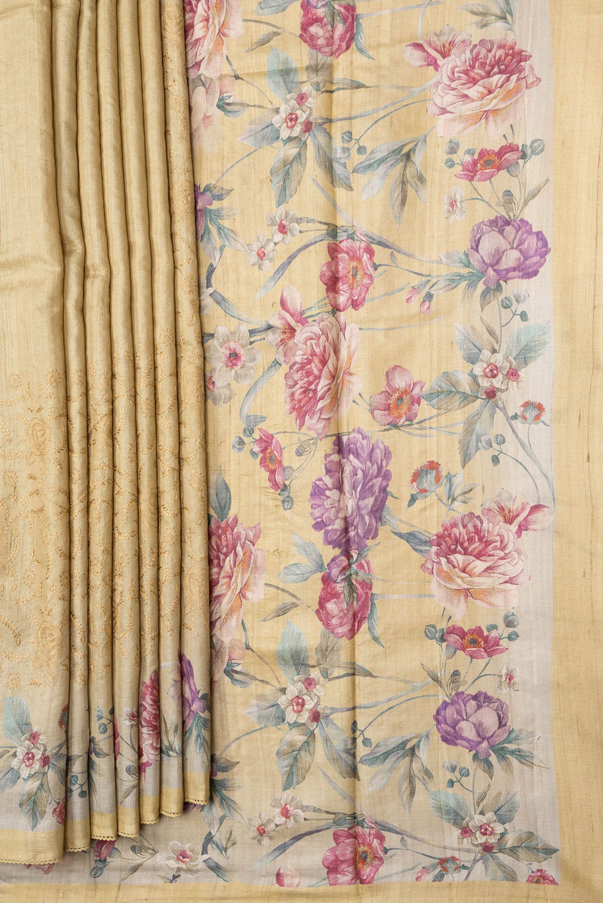 Pleats and pallu of Sandal Dual Tone Tussar Silk Saree with Embroidery on the body and Printed Border. 