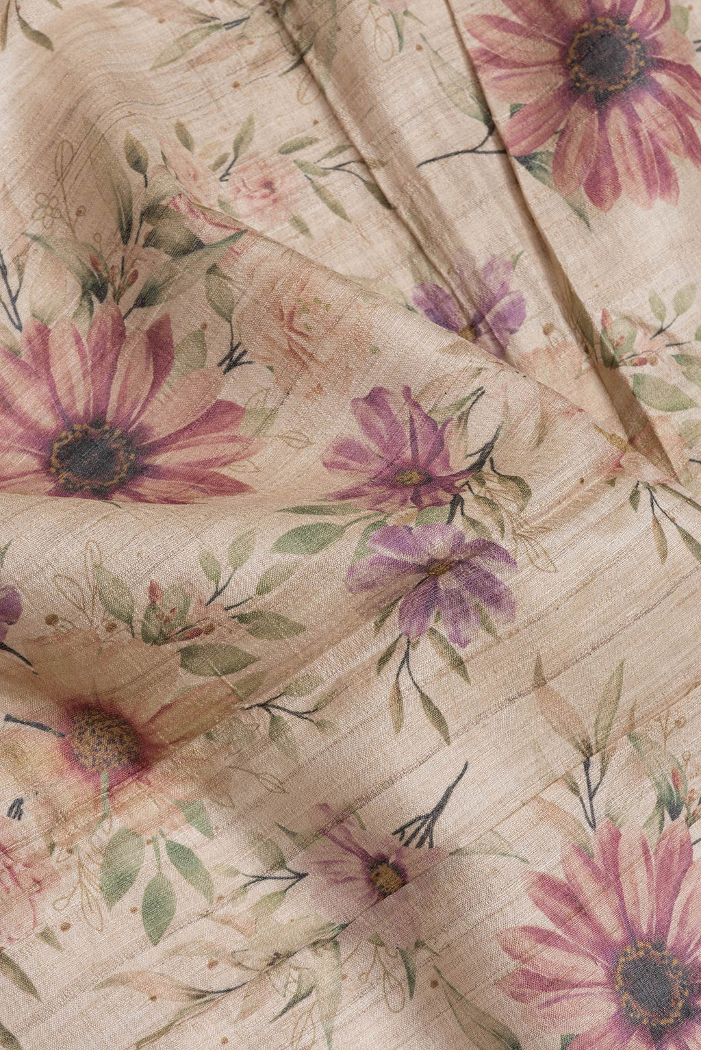 Close up of Beige Dual Tone Tussar Silk Saree with Printed design on the body and Zari Border.  displaying folds
