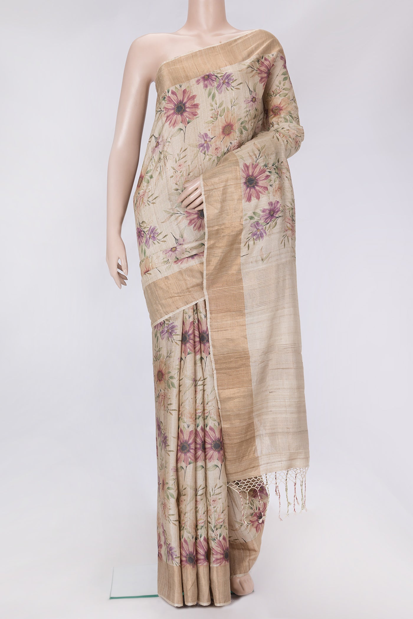 Beige Dual Tone Tussar Silk Saree with Printed design on the body and Zari Border.  displayed on a mannequin