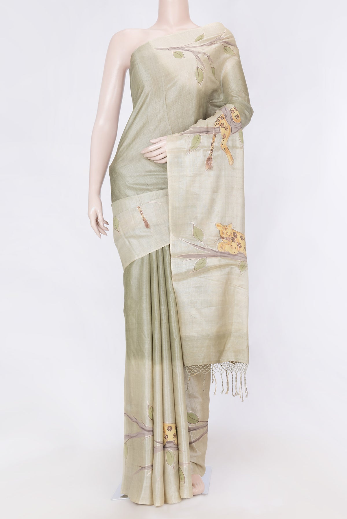 Green Dual Tone Tussar Saree with Zari And Thread Butta on the body and Without Border displayed on a mannequin