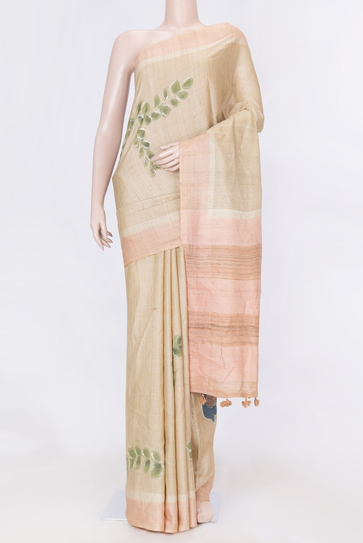 Beige Dual Tone Tussar SareePrinted design on the body and Embroidery Border displayed on a mannequin