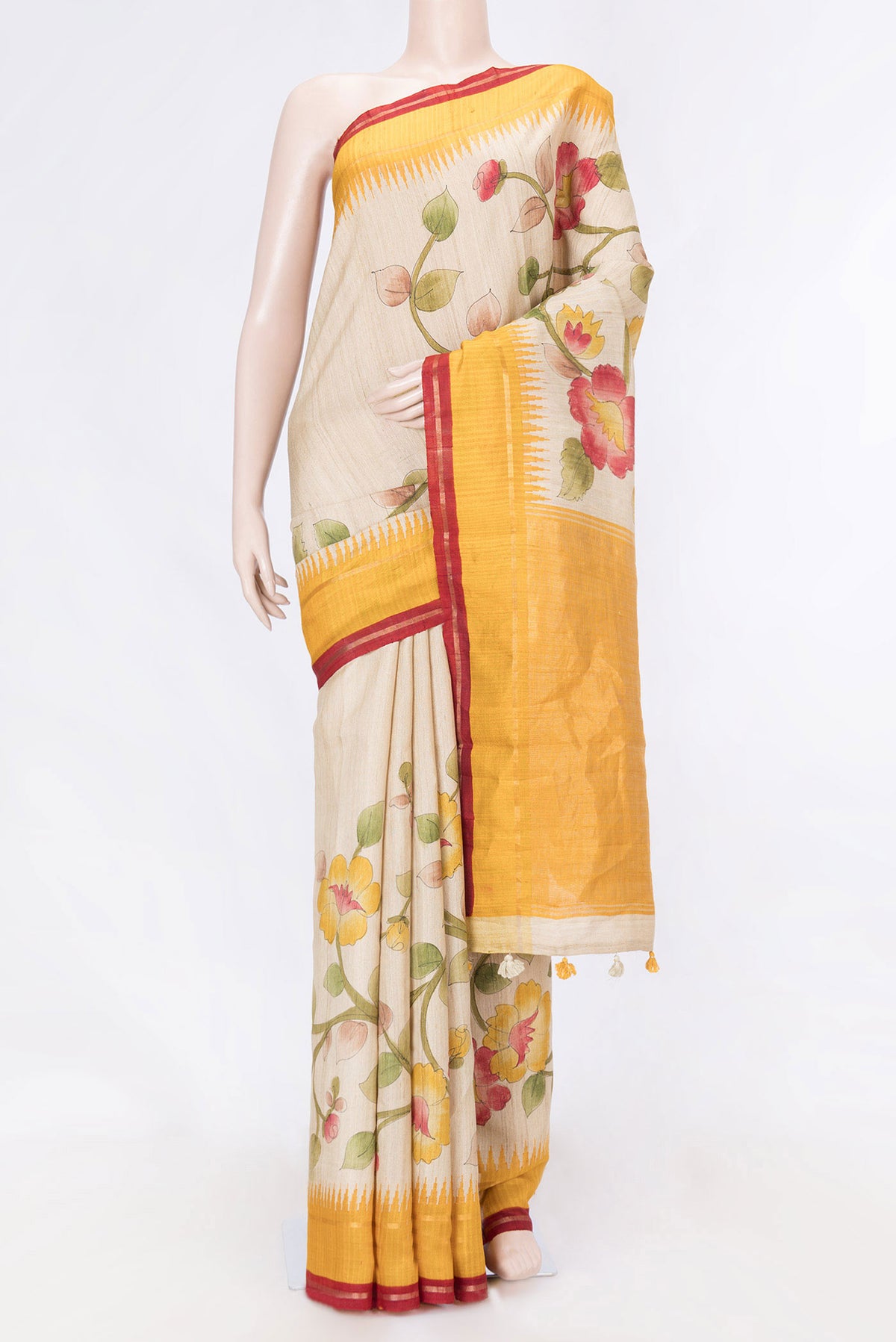 Beige Dual Tone Tussar Saree with Printed design on the body and Zari Border displayed on a mannequin