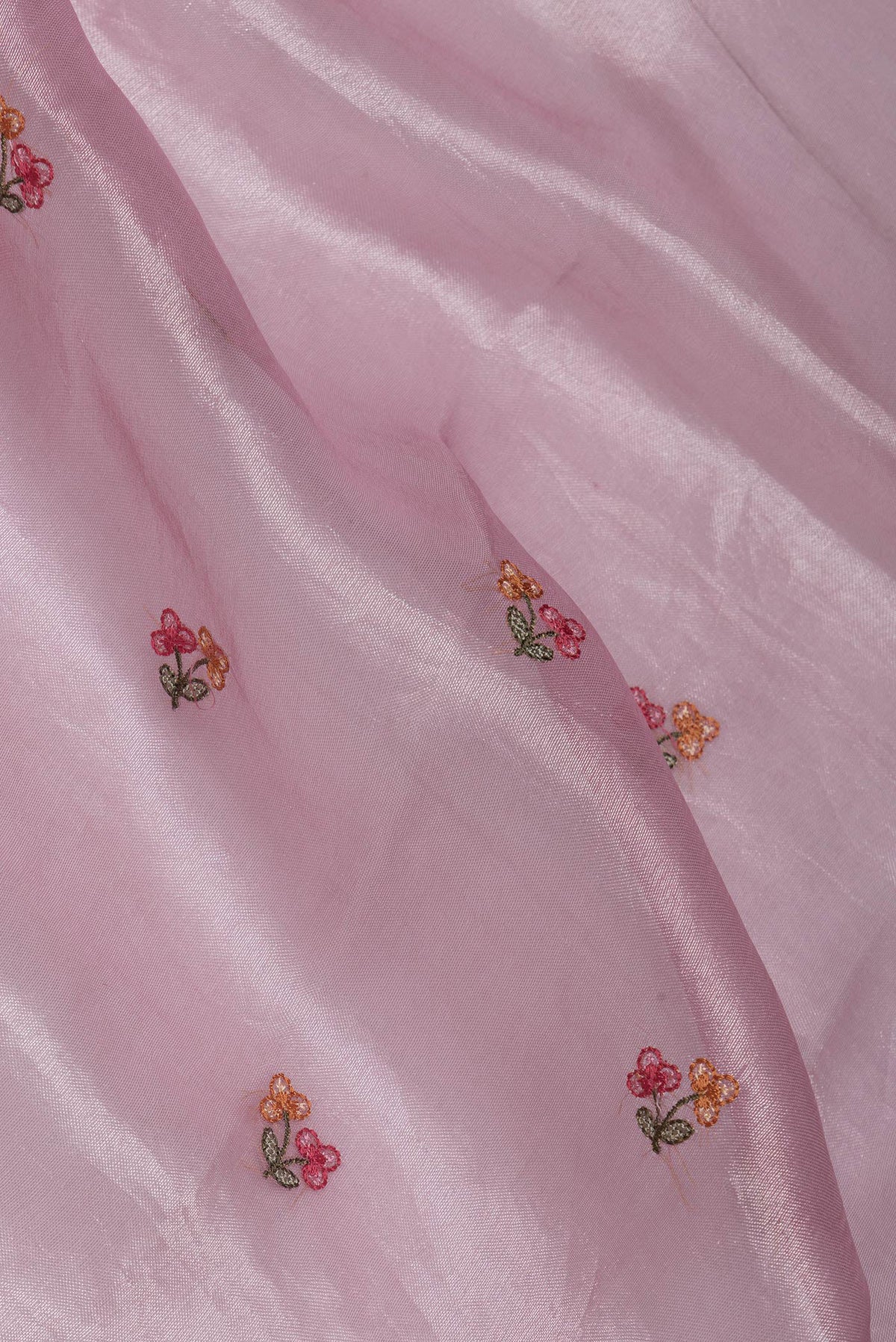 Close up of Pink Dual Tone Organza Silk Saree with Embroidery on the body and Embroidery Border.  displaying folds
