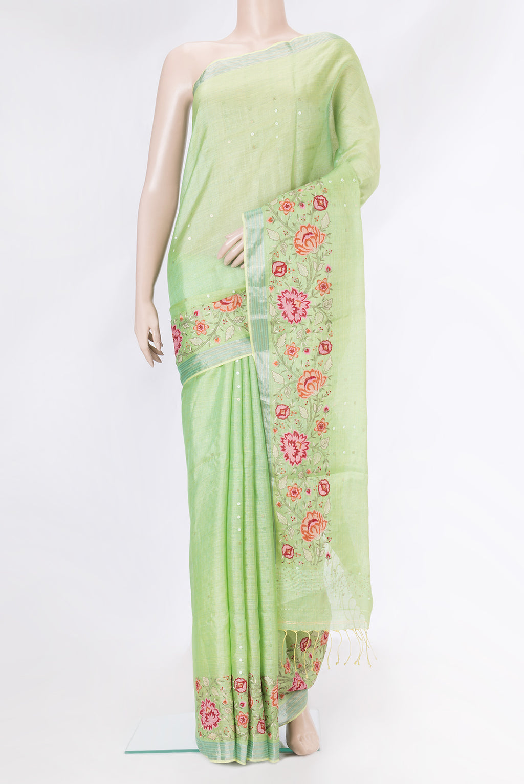 Pista Green Dual Tone Tussar Silk Saree with Embroidery on the body and Embroidery Border.  displayed on a mannequin