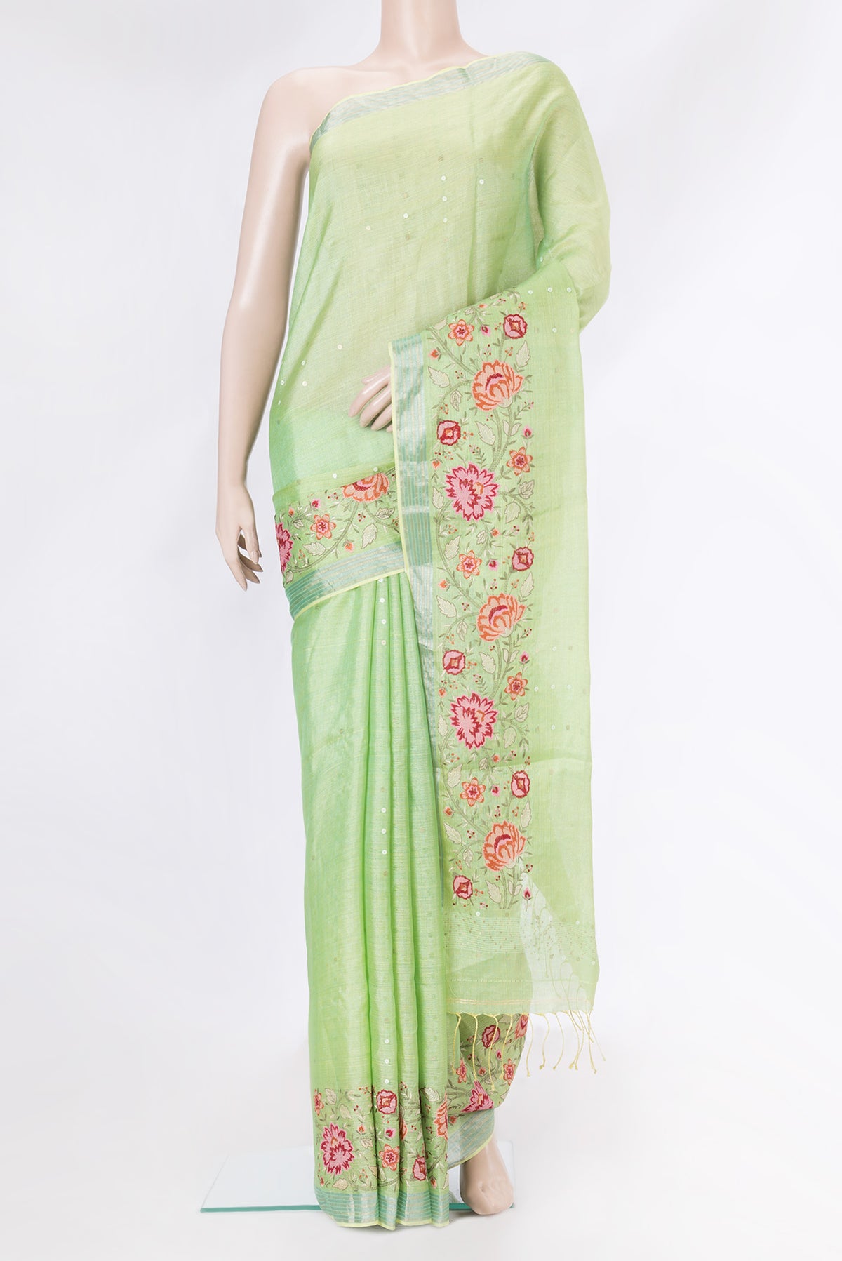 Pista Green Dual Tone Tussar Silk Saree with Embroidery on the body and Embroidery Border.  displayed on a mannequin