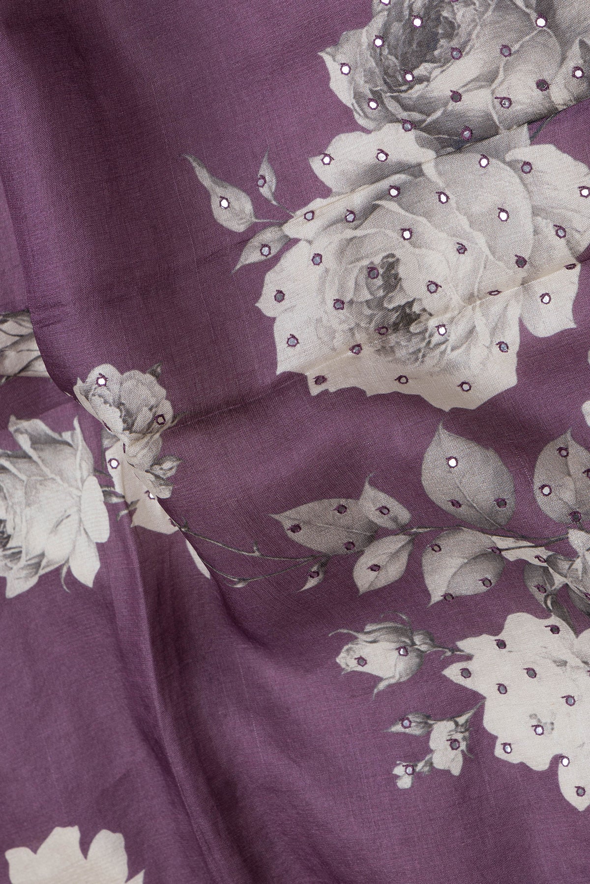 Close up of Purple Dual Tone Tussar Silk Saree with Embroidery on the body and Without Border.  displaying folds