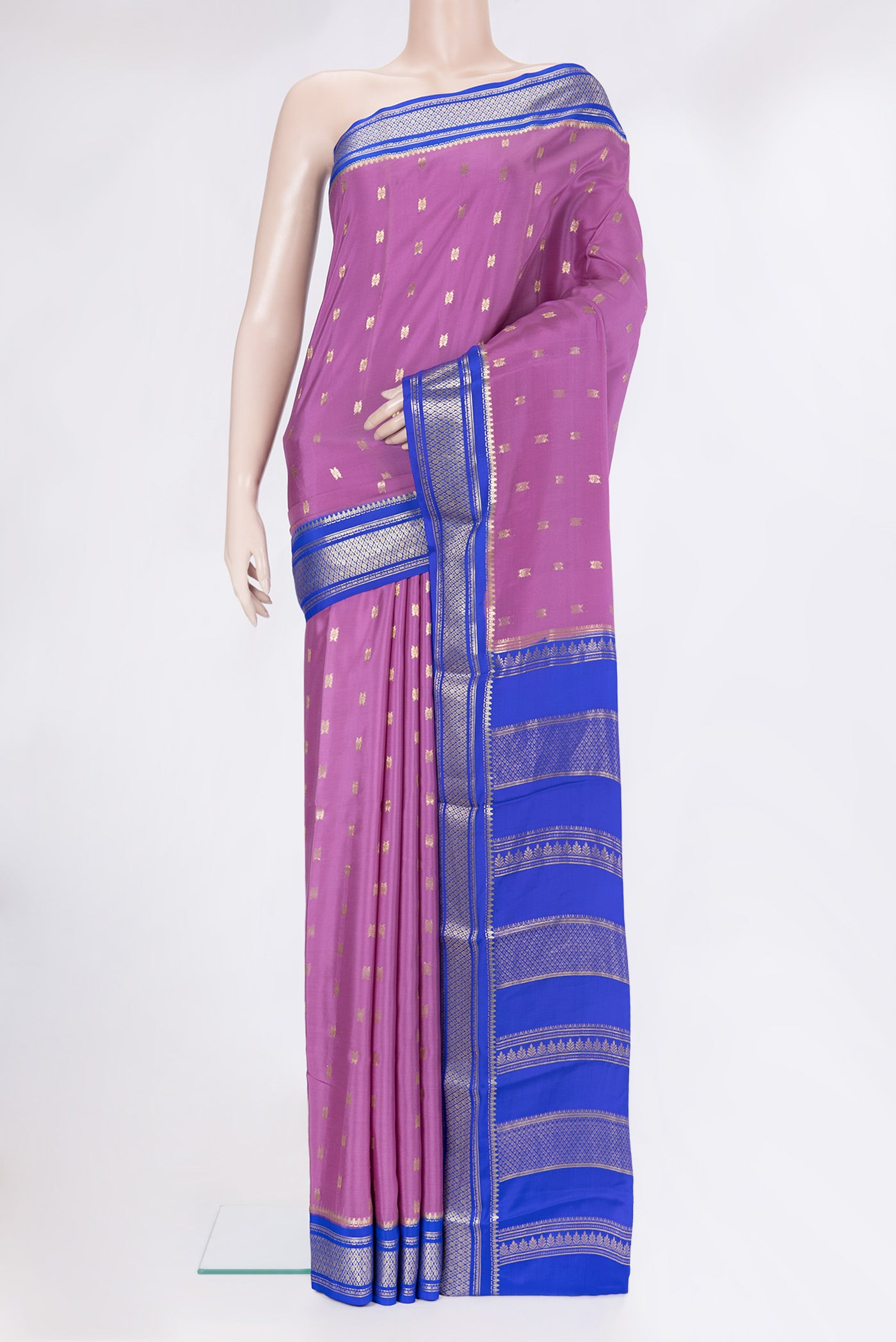 Purple Mysore Silk Saree with Zari Butta on the body and Zari Border.  displayed on a mannequin