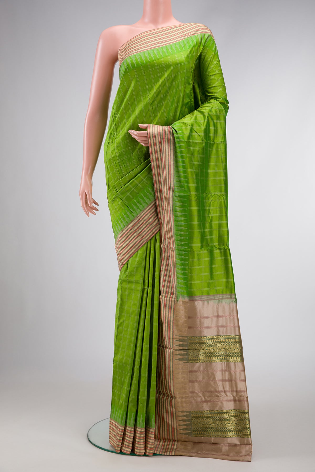 Parrot Green Dual Tone Kanjivaram Silk Saree with Checked design on the body and Zari Border.  displayed on a mannequin