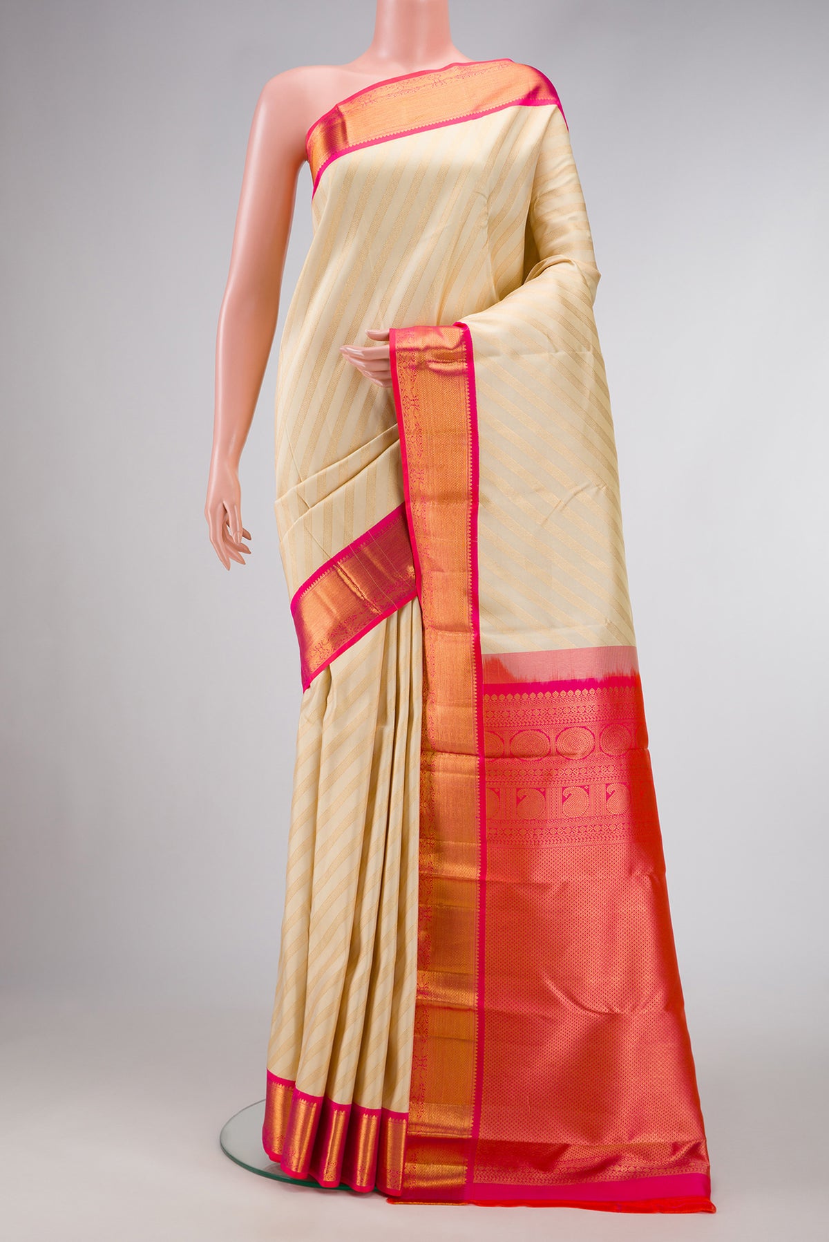 Sandal Dual Tone Kanjivaram Silk Saree with Zari Brocade on the body and Zari Border.  displayed on a mannequin