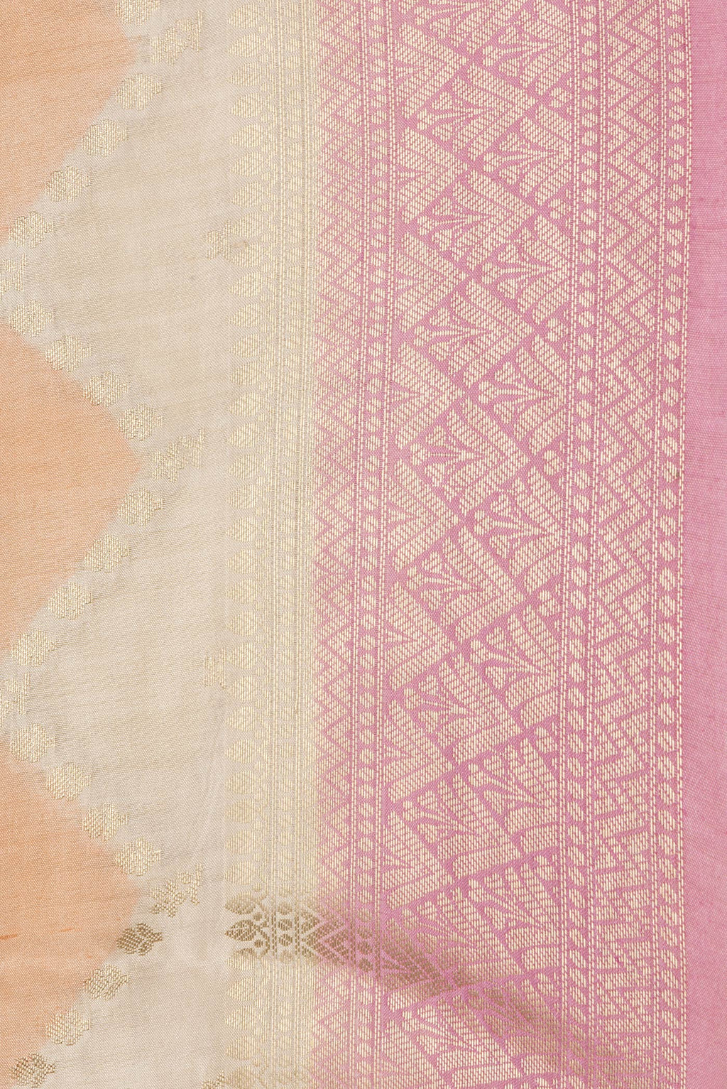Close up of Pink, Orange and Sandal Color Tussar Silk Saree with Zig Zag design on the body and Zari Border.  displaying folds
