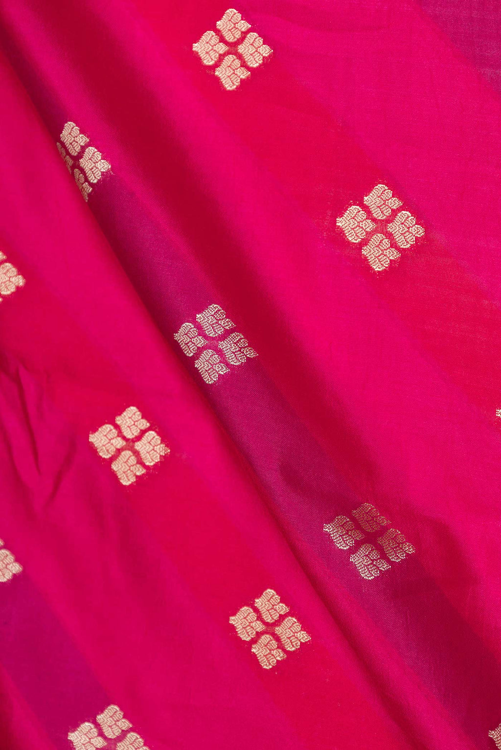 Close up of Pink Banarasi Raw Silk Saree with Zari Butta on the body and Zari Border displaying folds
