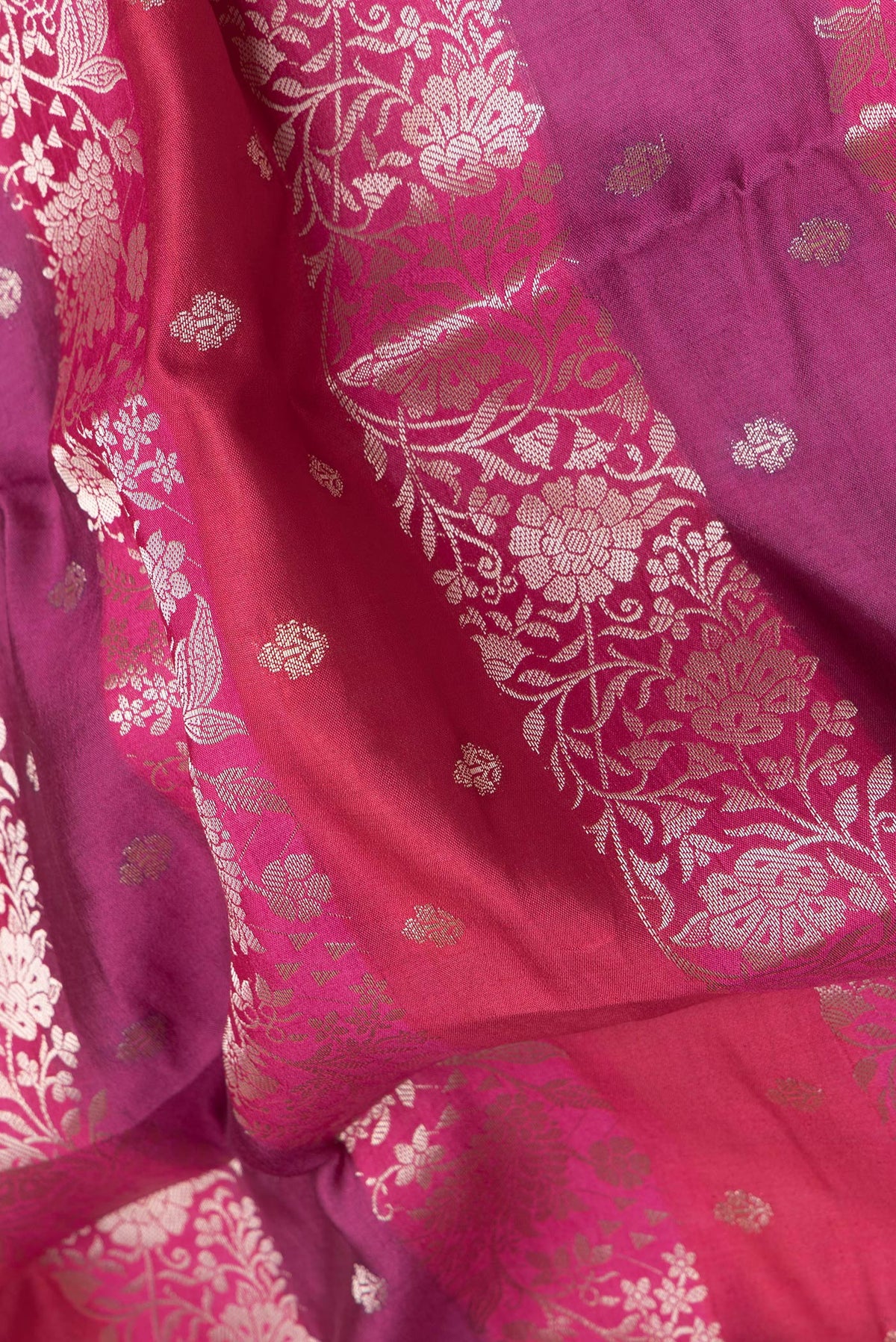 Close up of Purple and Maroon Color Tussar Silk Saree with Zari Brocade on the body and Zari Border.  displaying folds