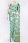 Green Dual Tone Tussar Silk Saree with Zari Butta on the body and Zari Border displayed on a mannequin