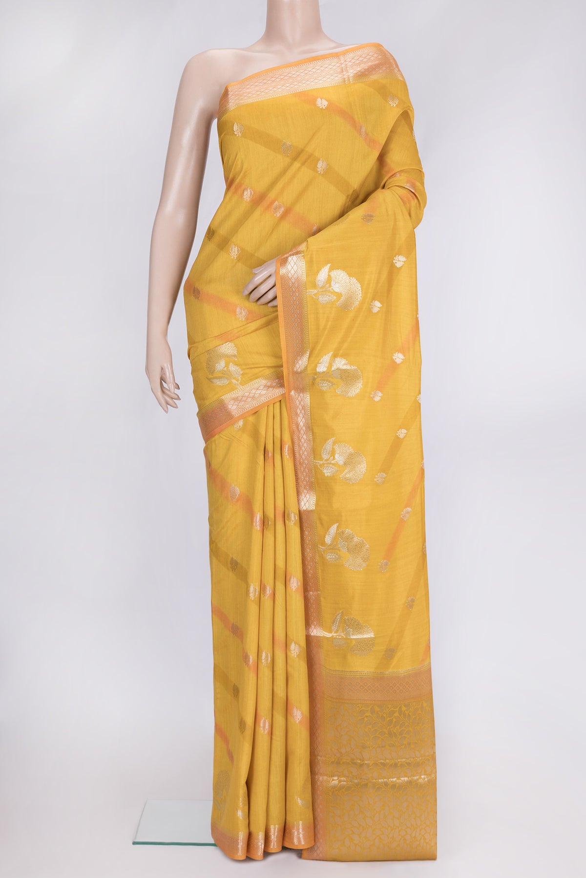 Mustard Dual Tone Tussar Silk Saree with Zari Butta on the body and Zari Border.  displayed on a mannequin