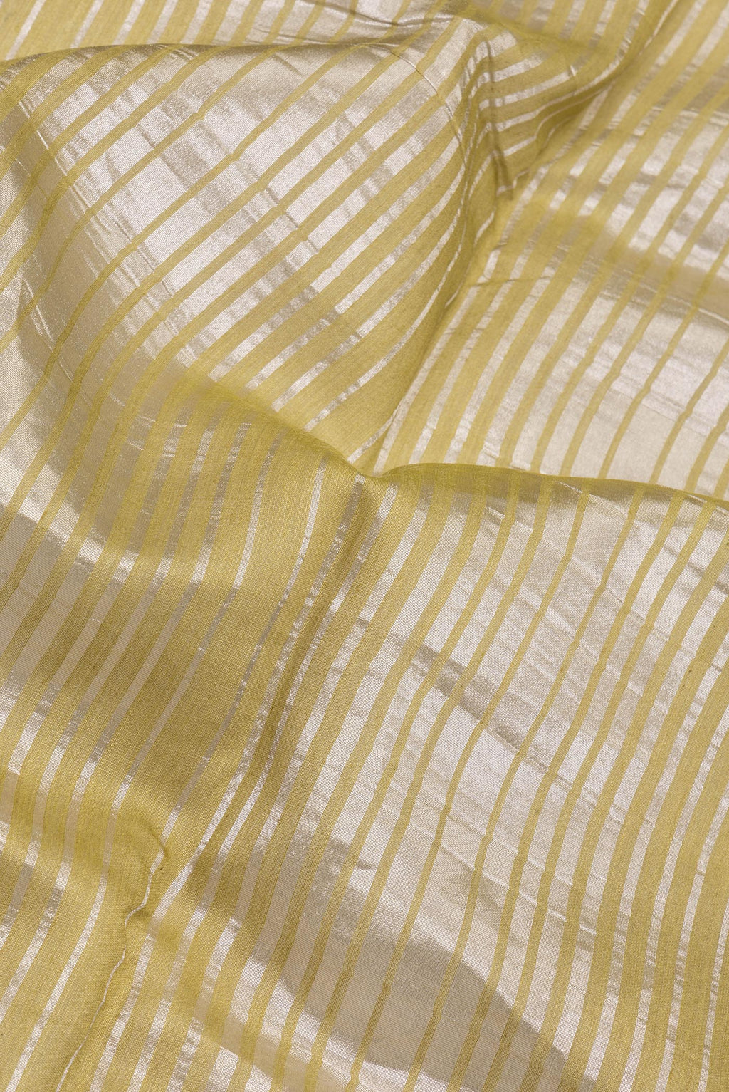 Close up of Multi Color Tussar Silk Saree with Stripes on the body and Zari Border.  displaying folds