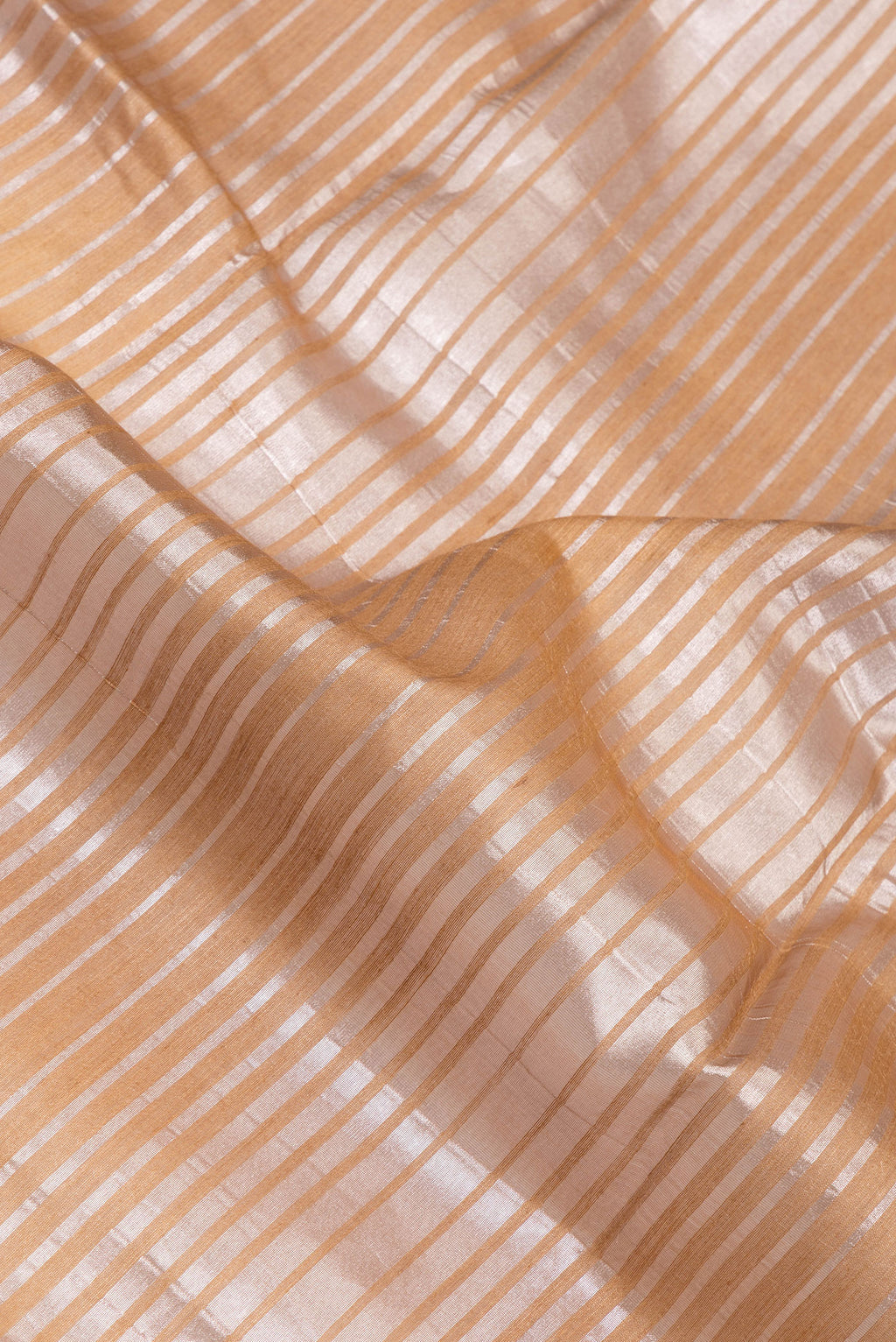 Close up of Multi Color Tussar Silk Saree with Stripes on the body and Zari Border.  displaying folds