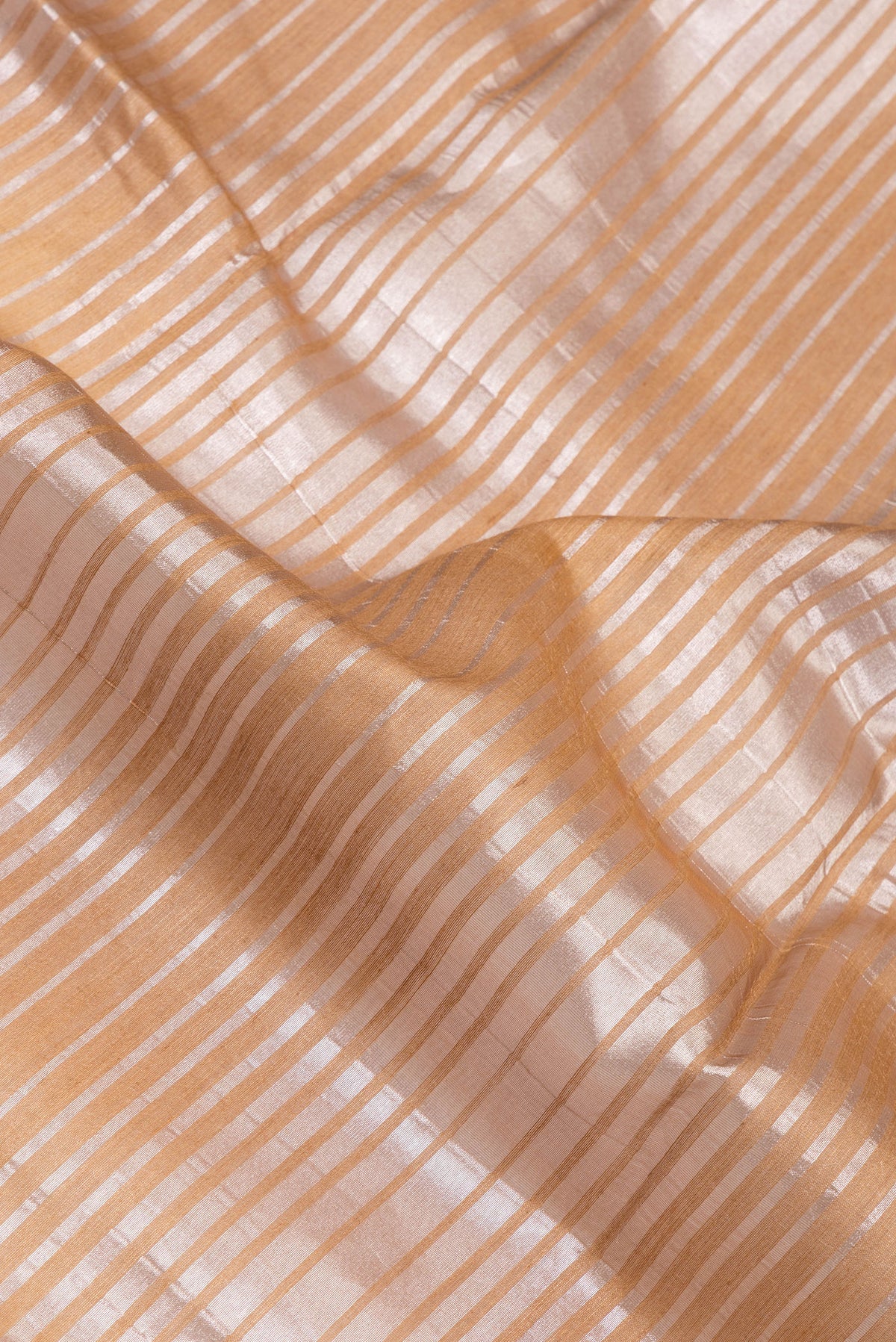 Close up of Multi Color Tussar Silk Saree with Stripes on the body and Zari Border.  displaying folds