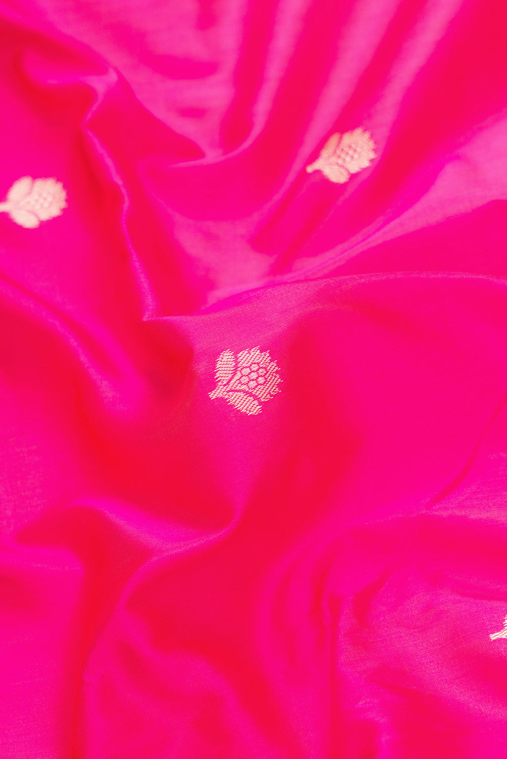Close up of Pink Dual Tone Banarasi Silk Saree with Zari Butta on the body and Zari Border.  displaying folds