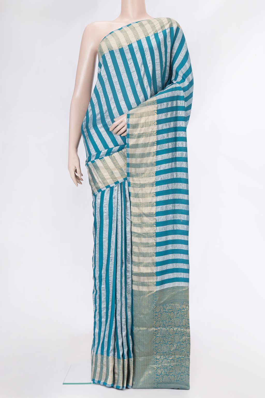 Sky Blue Dual Tone Tussar Silk Saree with Stripes on the body and Zari Border.  displayed on a mannequin