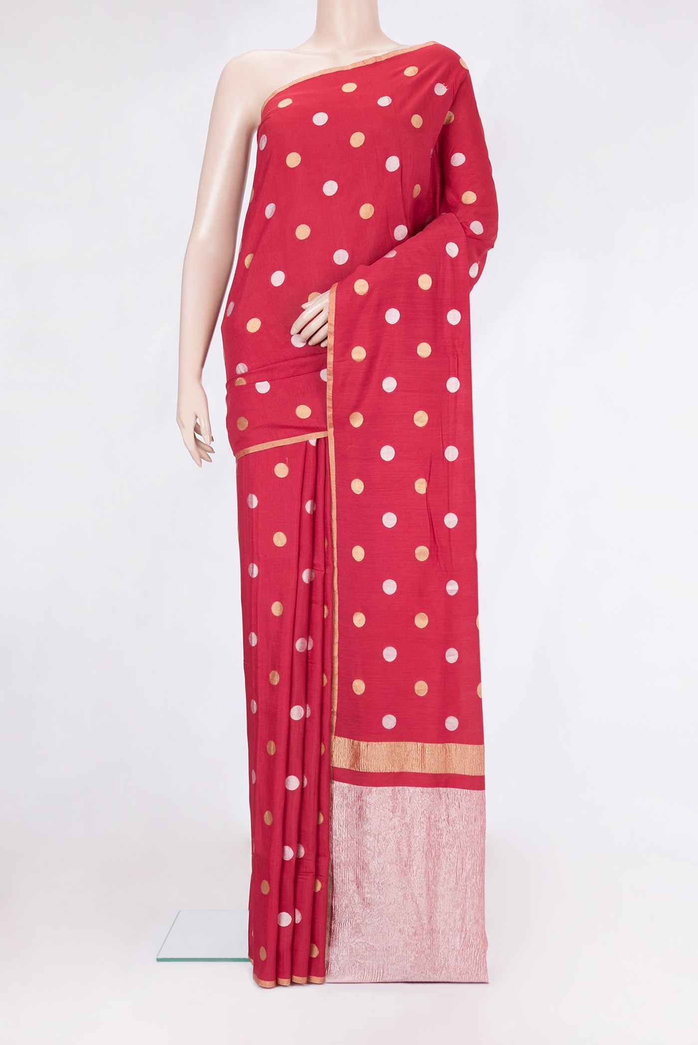 Red Tussar Silk Saree with Polka Dots on the body and Zari Border.  displayed on a mannequin