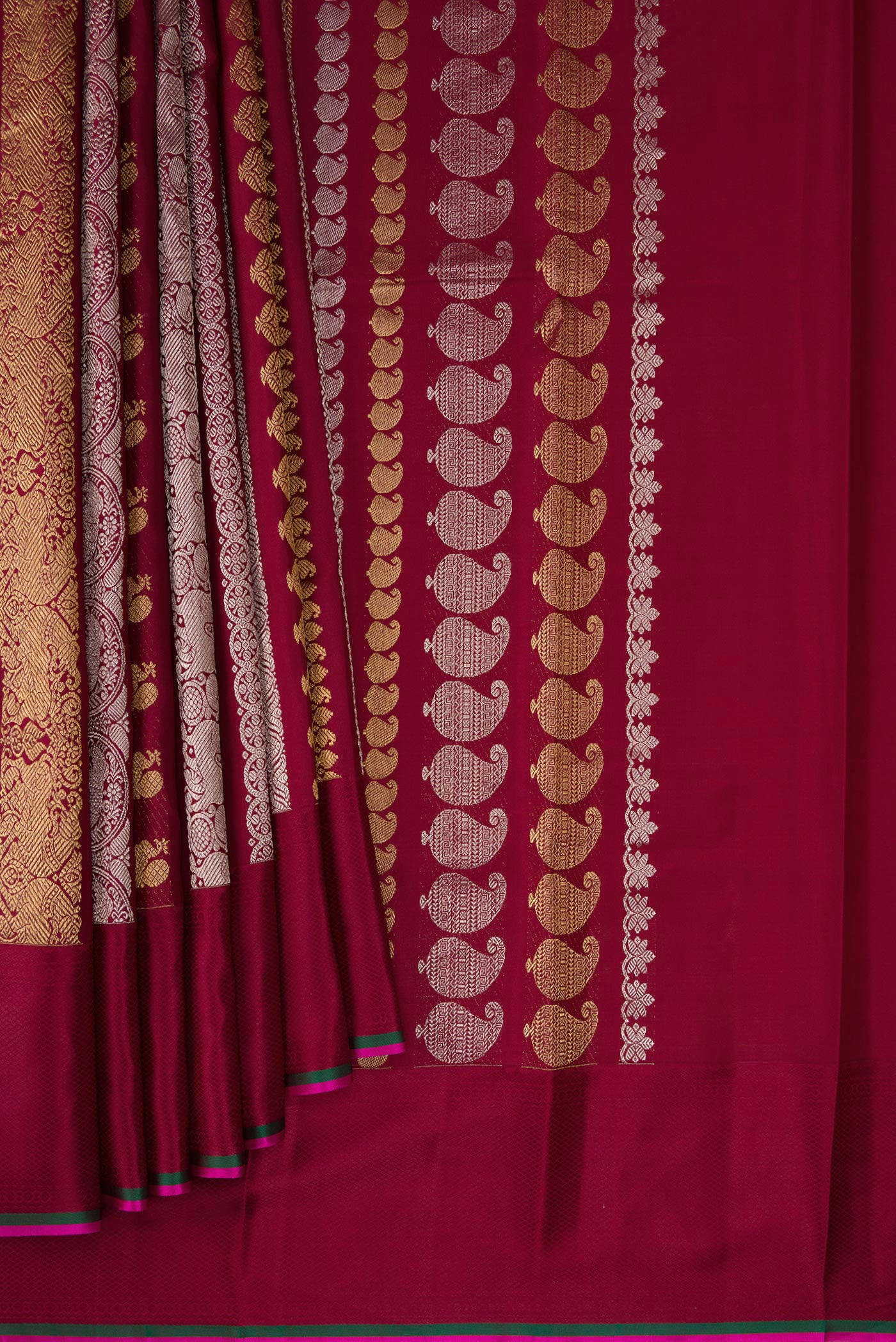 Pleats and pallu of Maroon Kanchipuram Silk Saree with Zari Brocade on the body and Thread Border. 