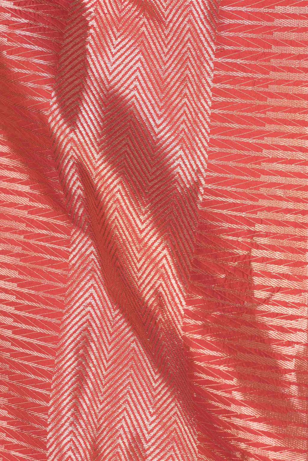 Close up of Red Dual Tone Banarasi Silk Saree with Zari Brocade on the body and Zari Border displaying folds