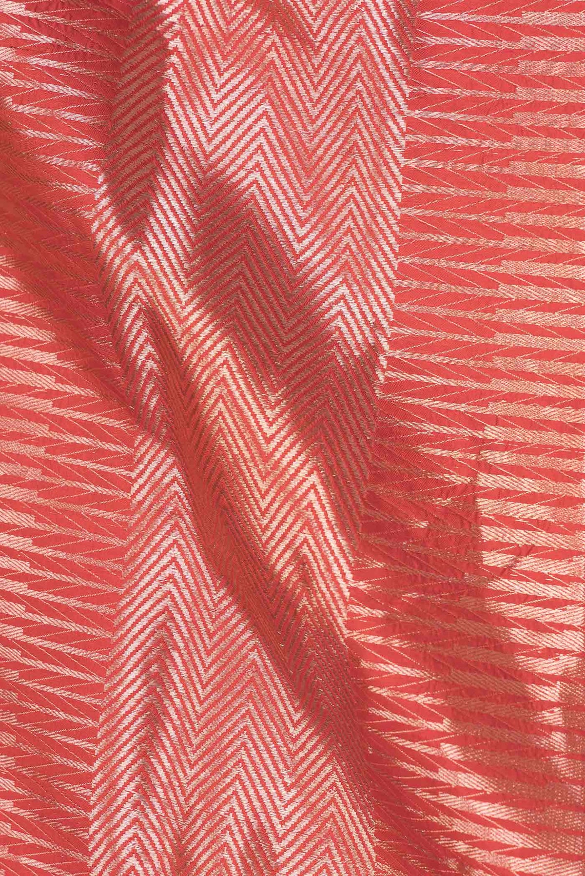 Close up of Red Dual Tone Banarasi Silk Saree with Zari Brocade on the body and Zari Border displaying folds
