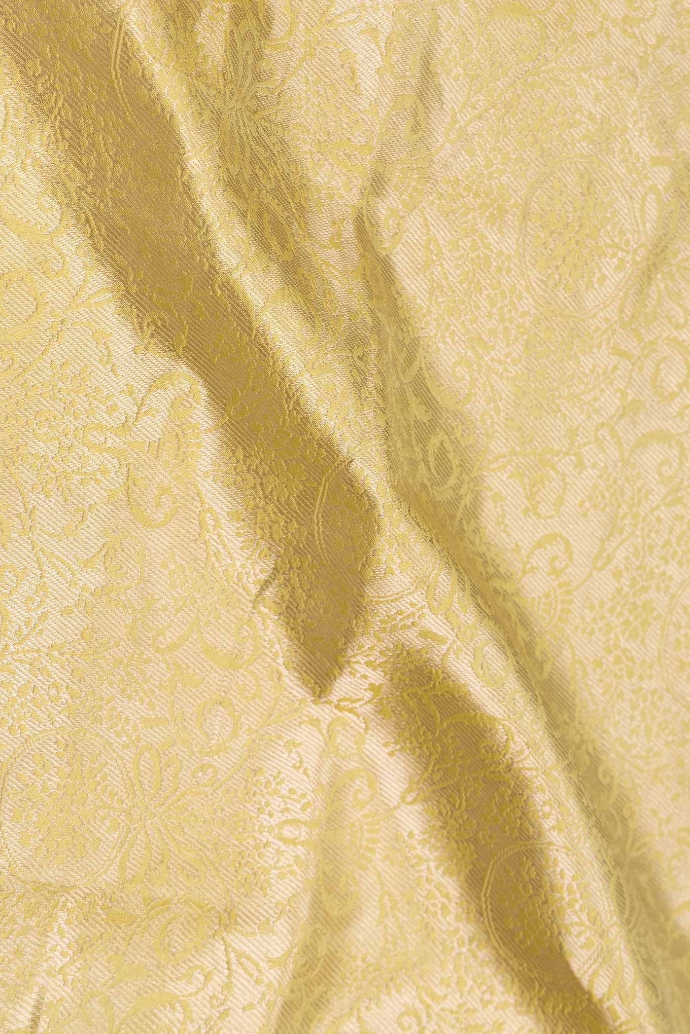 Close up of Light Green with Yellow Color Banarasi Silk Saree with Zari Brocade on the body and Zari Border displaying folds