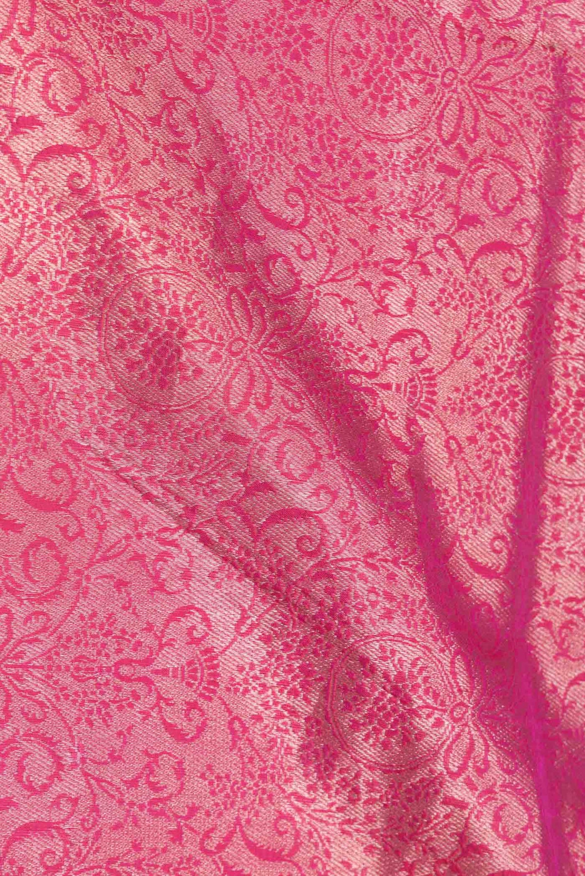 Close up of Pink Dual Tone Banarasi Silk Saree with Zari Brocade on the body and Zari Border displaying folds