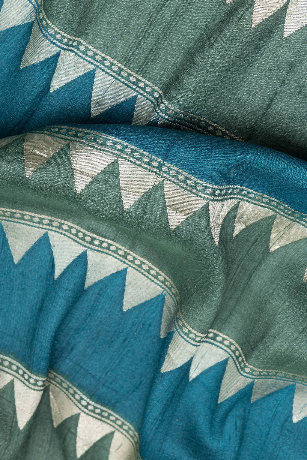 Close up of Multi Color Tussar Silk Saree with Stripes on the body and Zari Border.  displaying folds